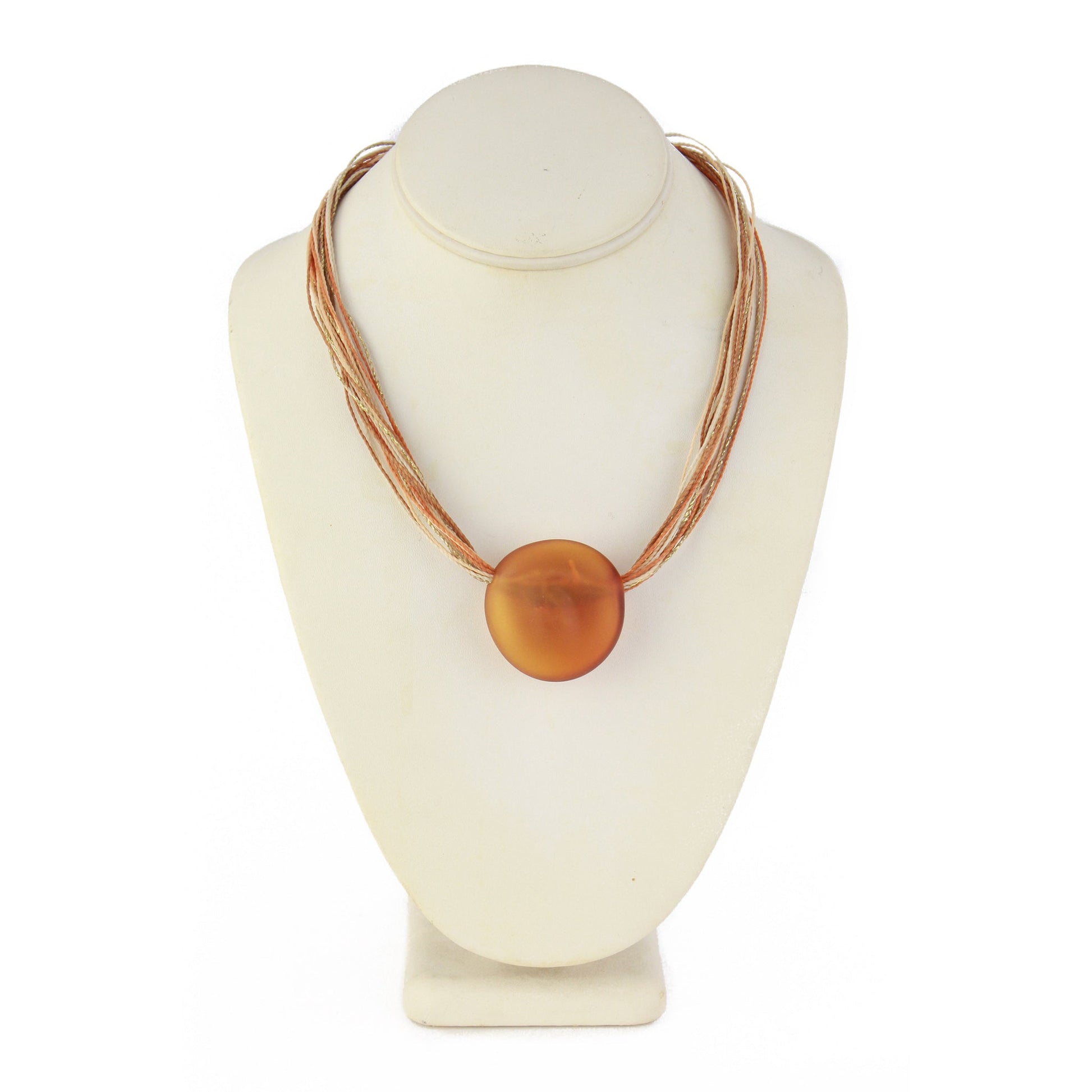 A necklace featuring a hand-blown amber glass focal bead strung on colorful multi-strand waxed cord. Finished with a sterling silver hook-and-loop clasp, this elegant piece combines warm tones with artisanal craftsmanship.