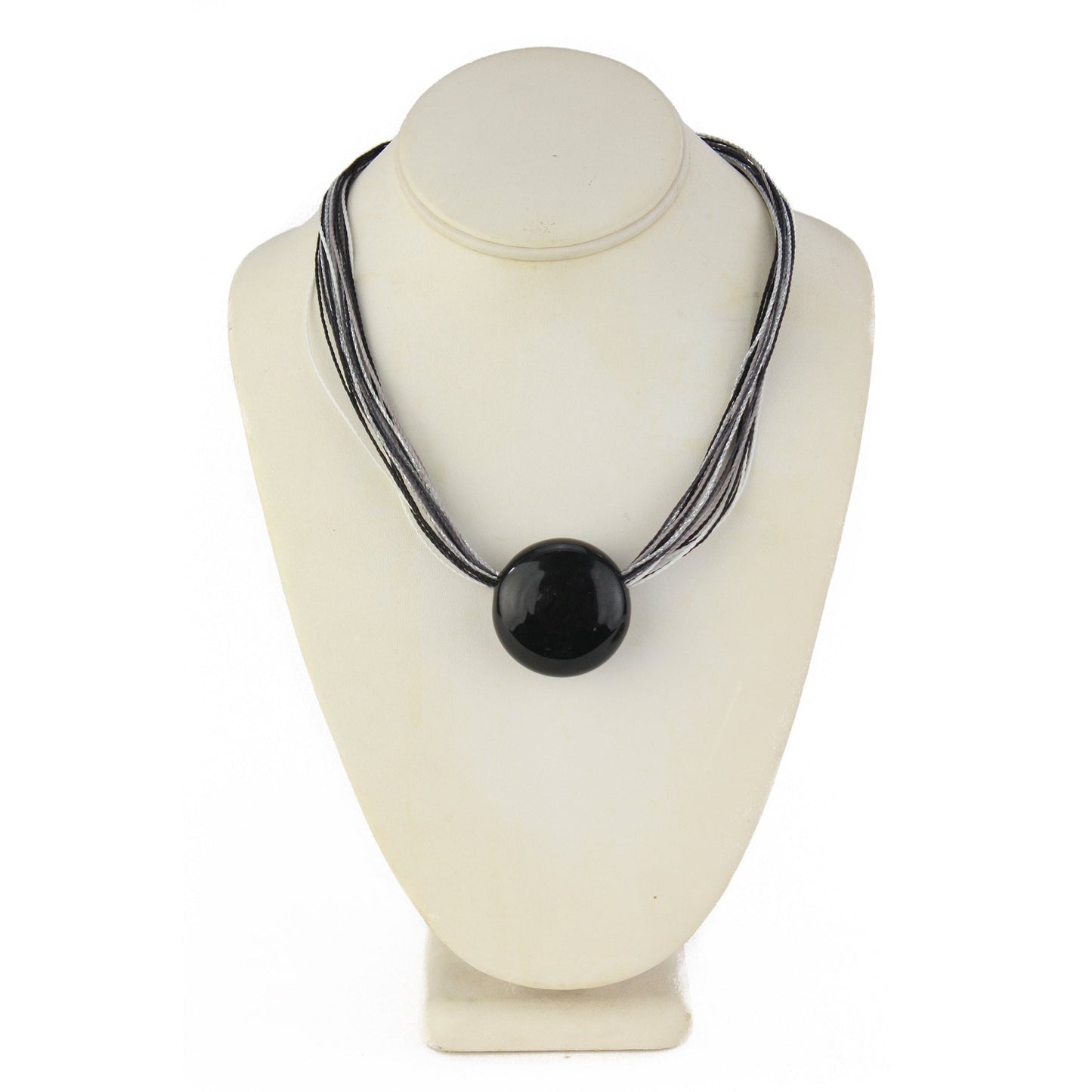 A sleek necklace featuring a hand-blown black glass focal bead strung on multi-strand waxed cord in black and silver tones. Finished with a sterling silver hook-and-loop clasp, this elegant piece offers a modern and sophisticated look.