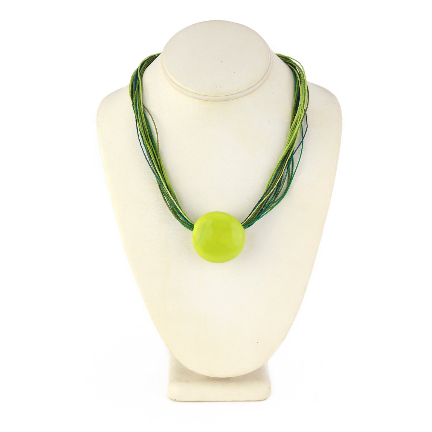 A vibrant necklace featuring a hand-blown green glass focal bead strung on multi-strand waxed cord in shades of green. Finished with a sterling silver hook-and-loop clasp, this piece adds a fresh, colorful accent to any outfit.