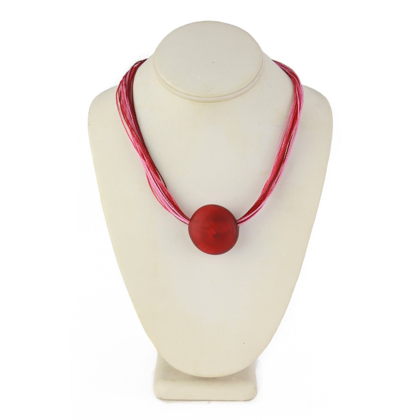 A romantic necklace featuring a hand-blown red glass focal bead strung on multi-strand waxed cord in rich shades of red and pink. Finished with a sterling silver hook-and-loop clasp, this piece adds a bold yet elegant touch to any outfit.