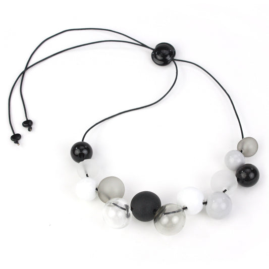 Elegant Offset Bolla Necklace with black, white, and gray hand-blown glass beads. Adjustable from 36" to choker length on fine leather. Perfect for any outfit!