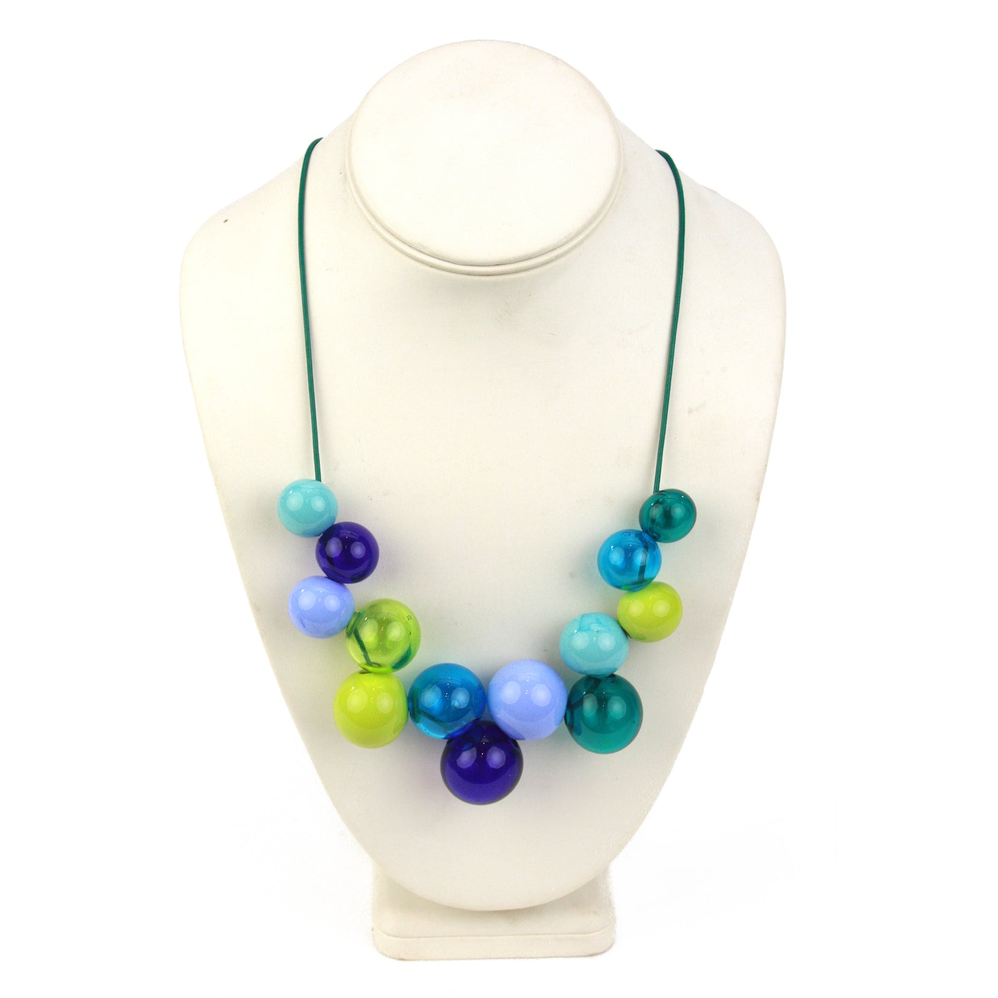 Hand-blown glass bead Offset Bolla Necklace in vivid blue, teal, and green hues. Adjustable length from 36" to choker on fine green leather. Bold and stylish!