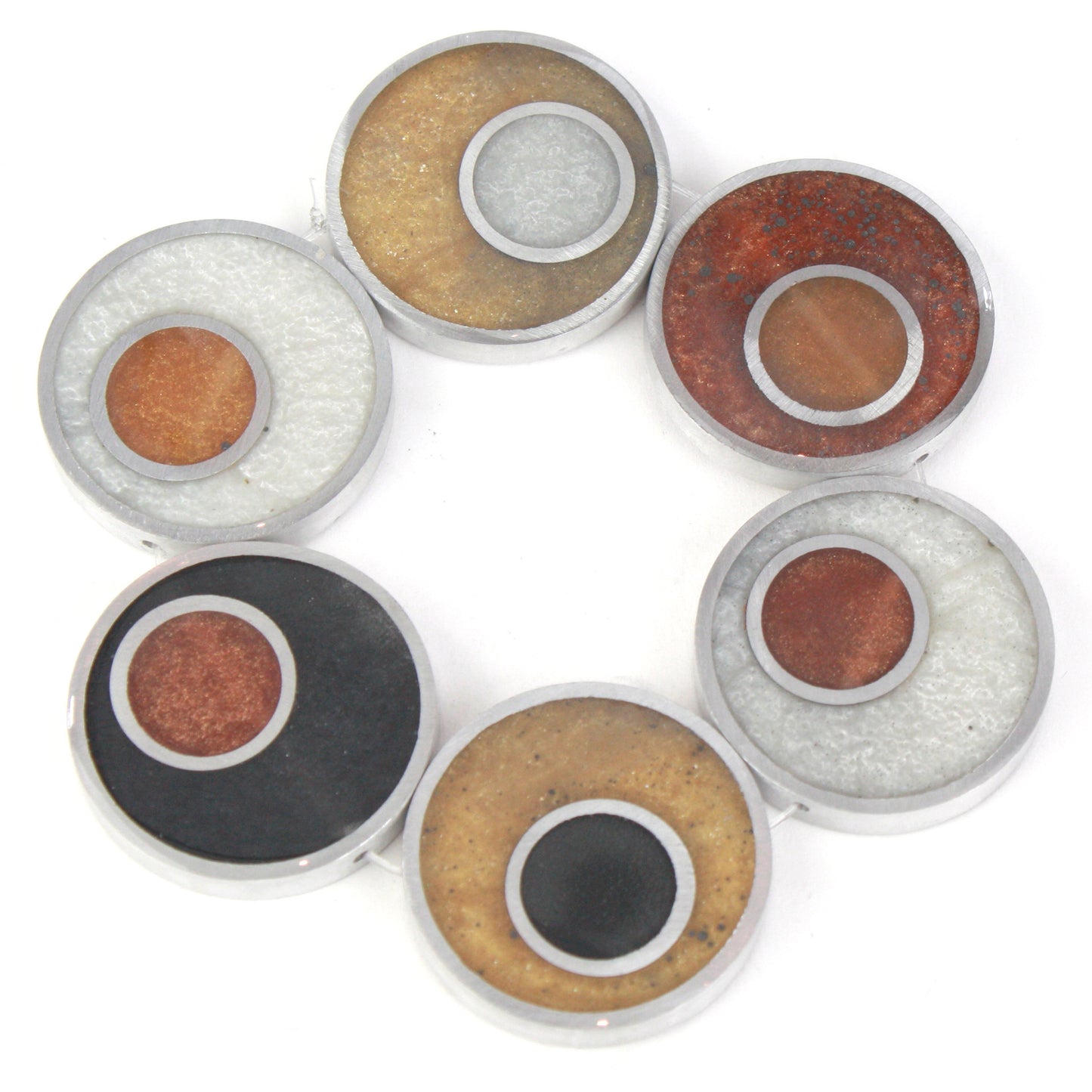 Resinique Double Circle Bracelet featuring layered circles of eco-resin in warm tones, set in salvaged aluminum and strung on an elastic band.