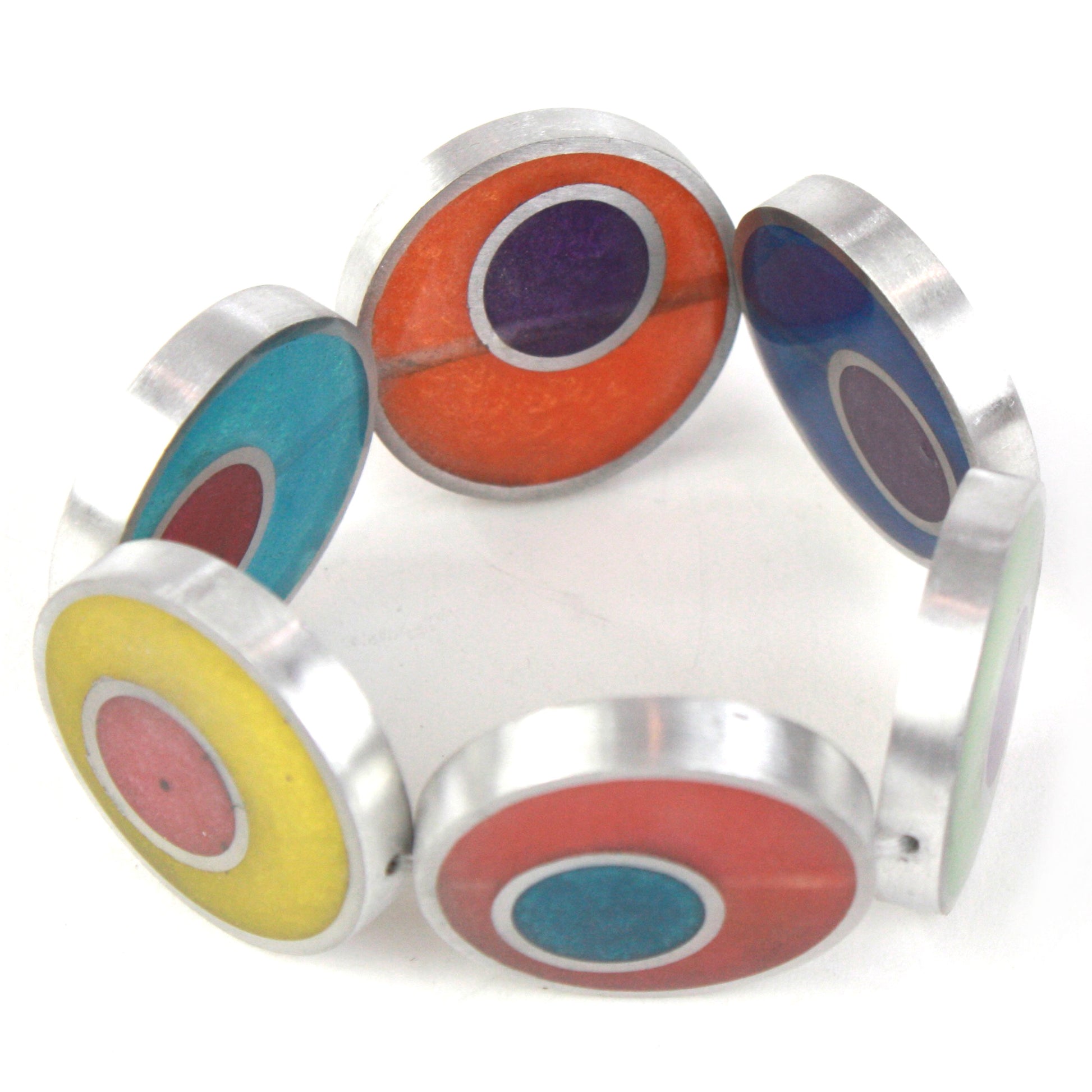 Resinique Double Circle Bracelet with rainbow-colored eco-resin designs layered in salvaged aluminum circles, strung on a comfortable elastic band.