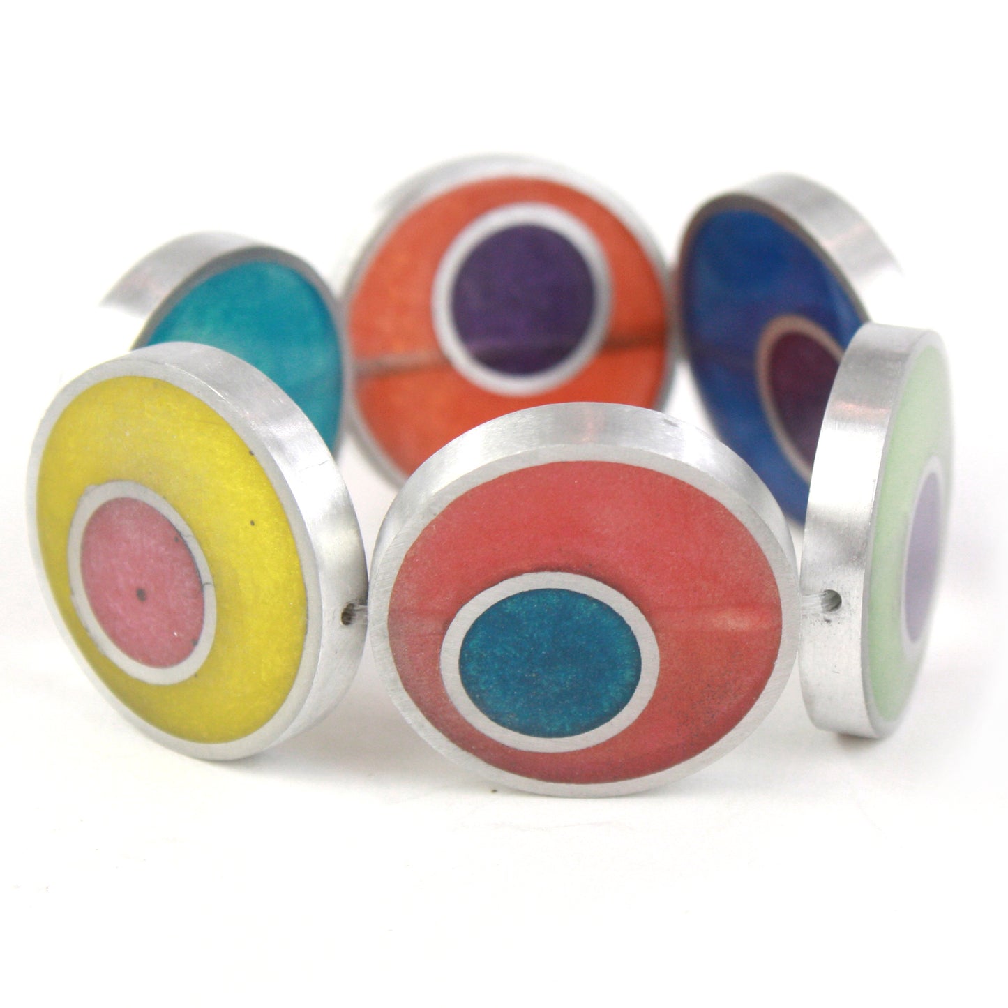 Resinique Double Circle Bracelet with rainbow-colored eco-resin designs layered in salvaged aluminum circles, strung on a comfortable elastic band.