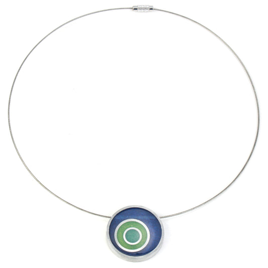 Resinique triple circle necklace with a dark blue, seafoam, and turquoise concentric circle resin and salvaged aluminum pendant on a choker-length steel cord.