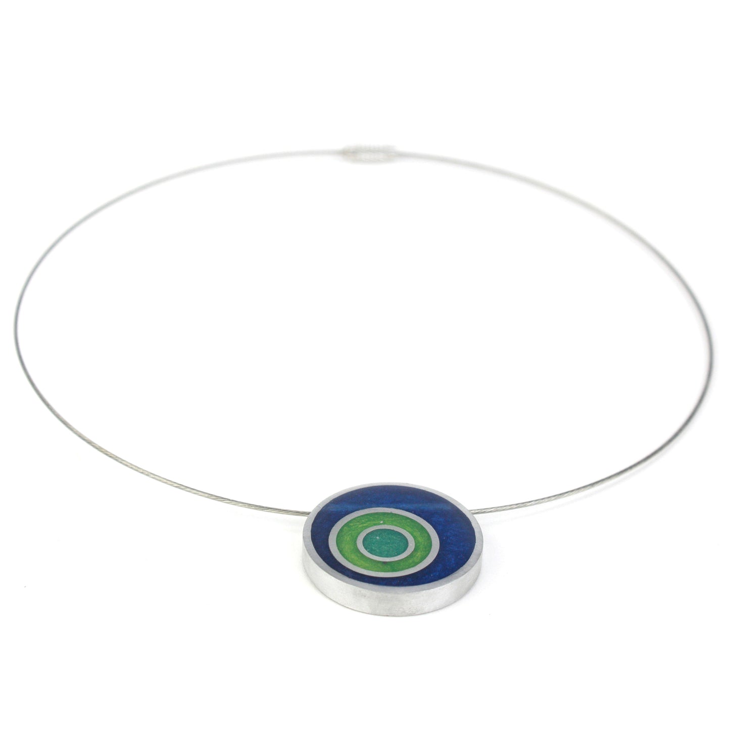 Resinique triple circle necklace with a dark blue, seafoam, and turquoise concentric circle resin and salvaged aluminum pendant on a choker-length steel cord.