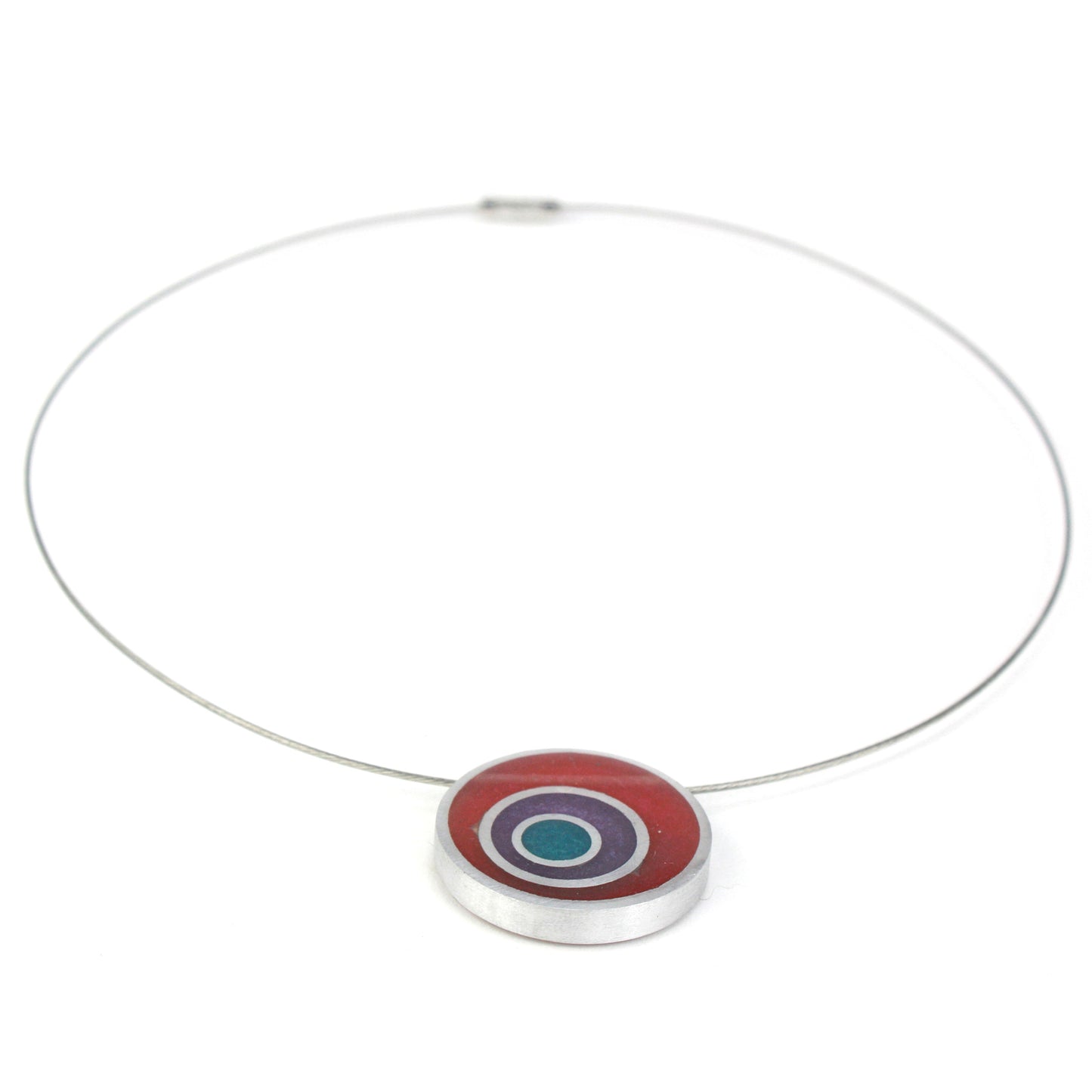 Resinique triple circle necklace with a purple, seafoam, and yellow concentric circle resin and salvaged aluminum pendant on a choker-length steel cord.