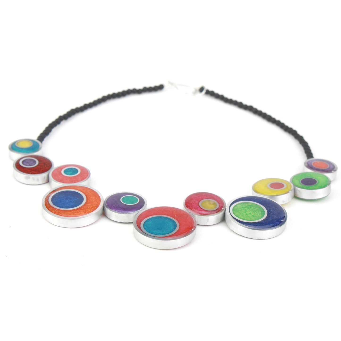 A colorful handcrafted offset necklace with eco-resin and salvaged aluminum beads in red, blue, yellow, green, and purple, finished with black glass beads.