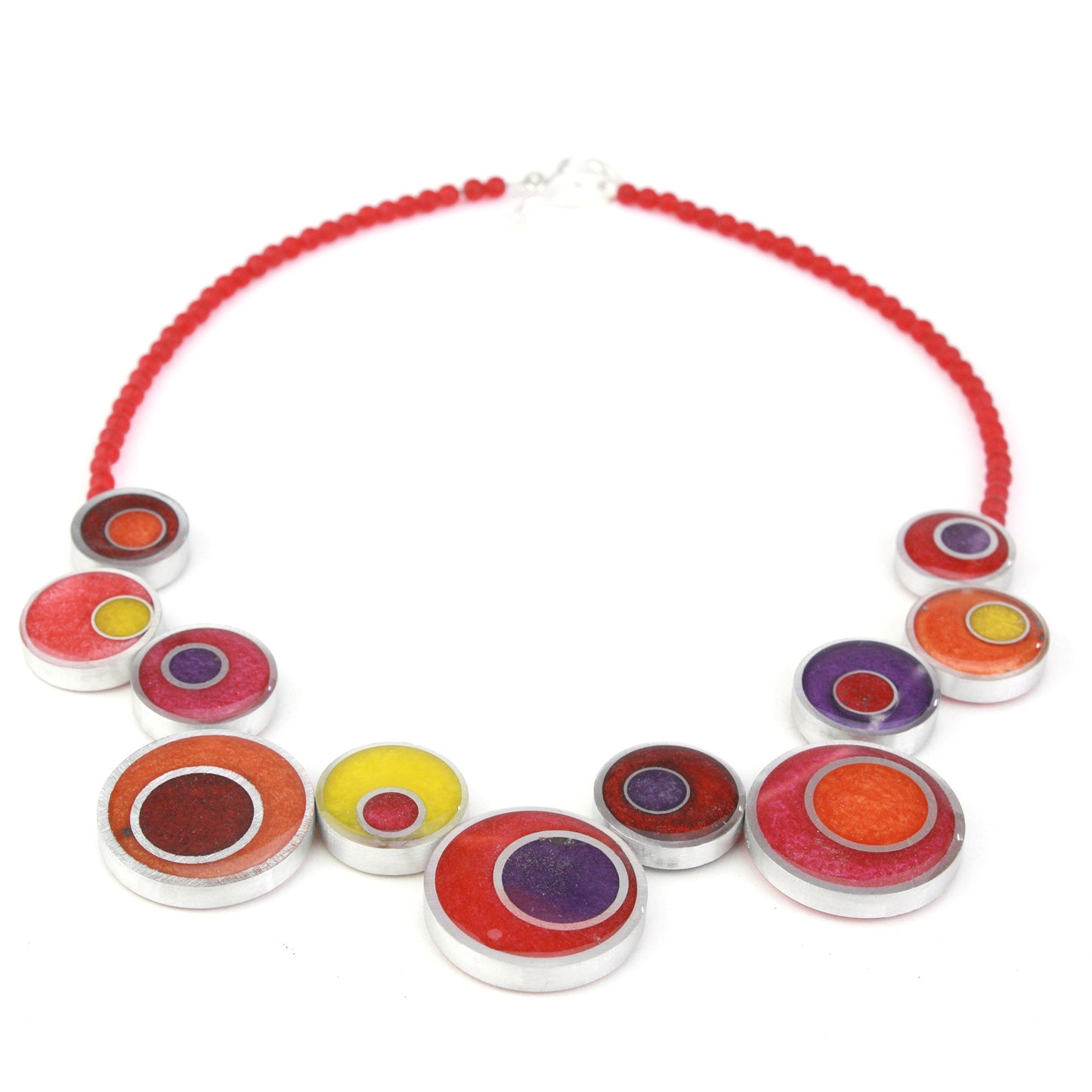 A handcrafted offset necklace featuring eco-resin and salvaged aluminum beads in red, orange, yellow, and purple, strung on red glass beads with a silver clasp.