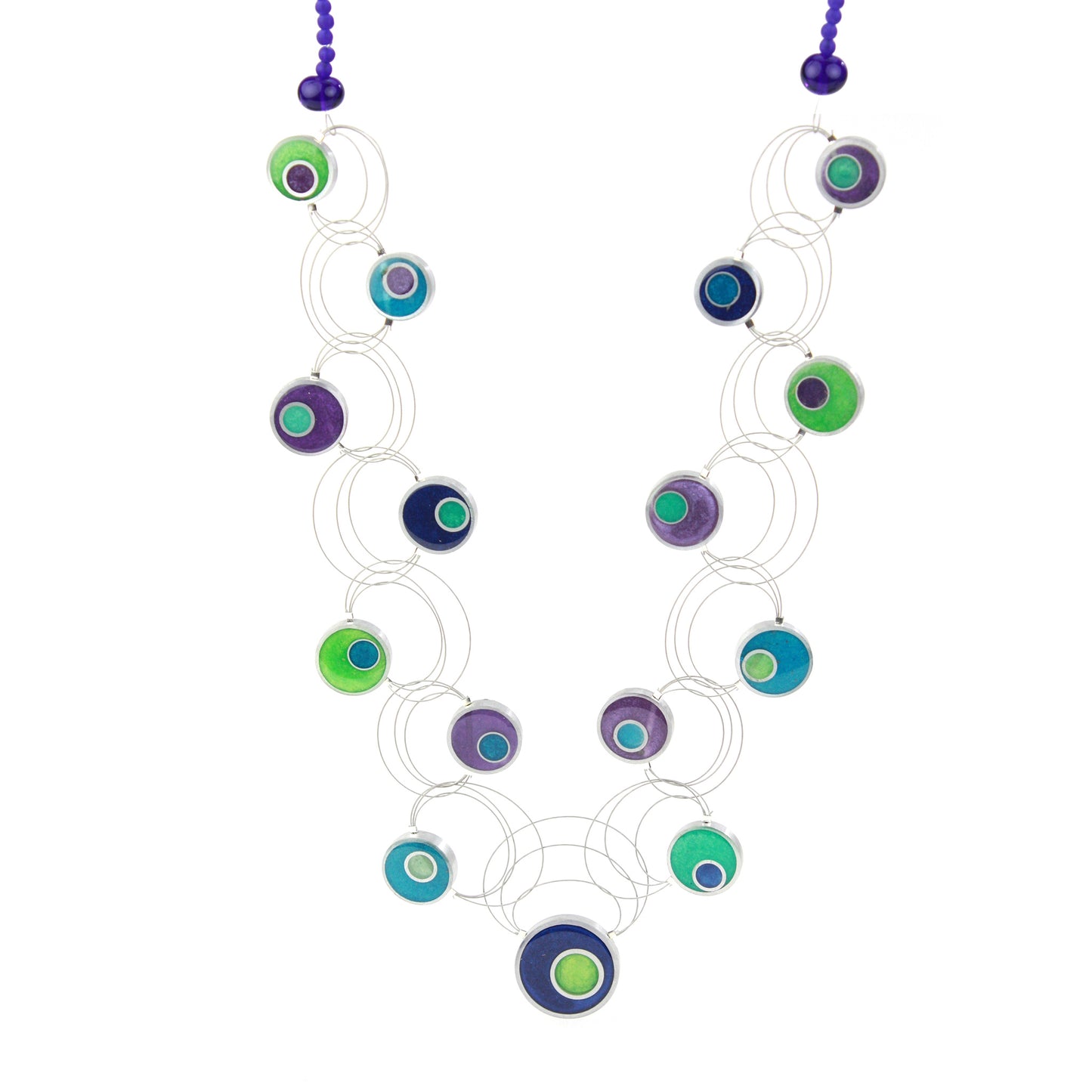 A handcrafted necklace featuring intertwining steel cables adorned with circular eco-resin and salvaged aluminum beads in shades of blue, green, and purple.