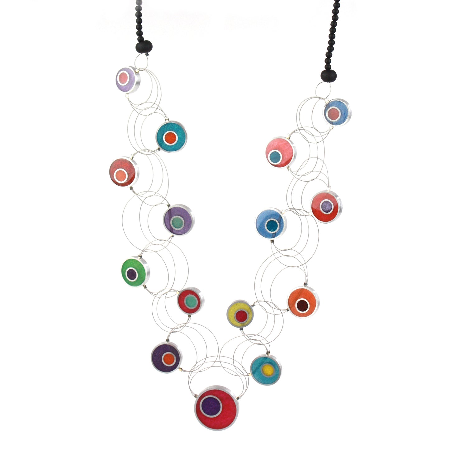 A handcrafted necklace with intertwining steel cables featuring multi-colored eco-resin and salvaged aluminum beads in vibrant shades of red, purple, green, blue, and orange.