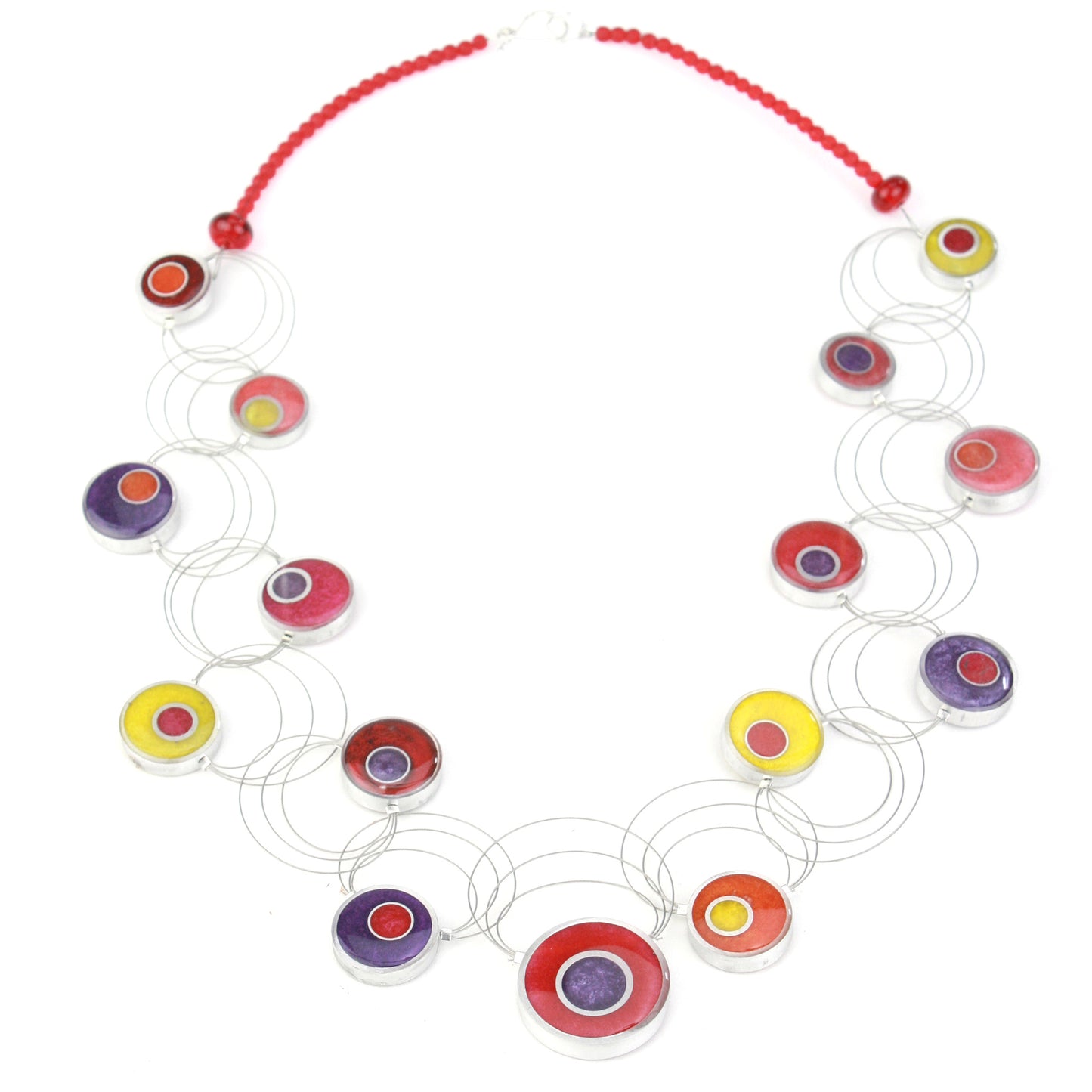 A handcrafted necklace featuring intertwining steel cables with eco-resin and salvaged aluminum beads in warm shades of red, orange, yellow, and purple.