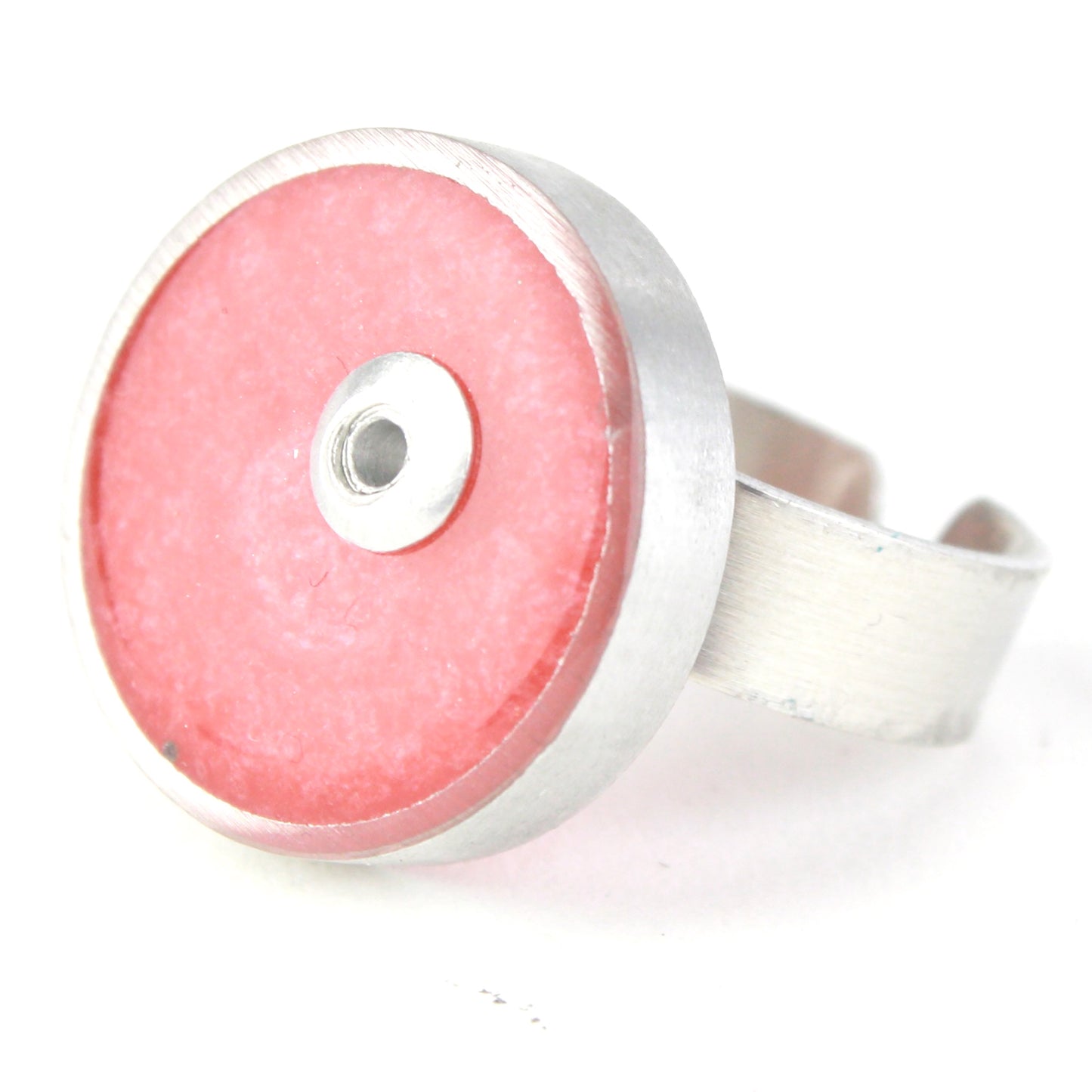 Light pink Resinique Single Circle Ring with a soft eco-resin centerpiece set in salvaged aluminum. Adjustable band for a customizable fit.