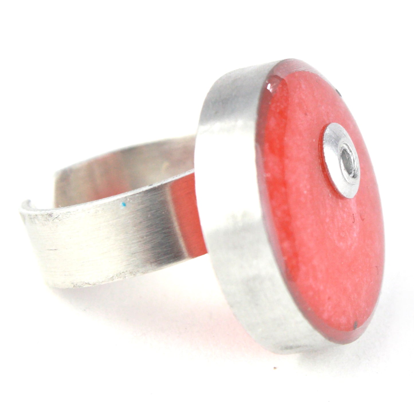 Light pink Resinique Single Circle Ring with a soft eco-resin centerpiece set in salvaged aluminum. Adjustable band for a customizable fit.