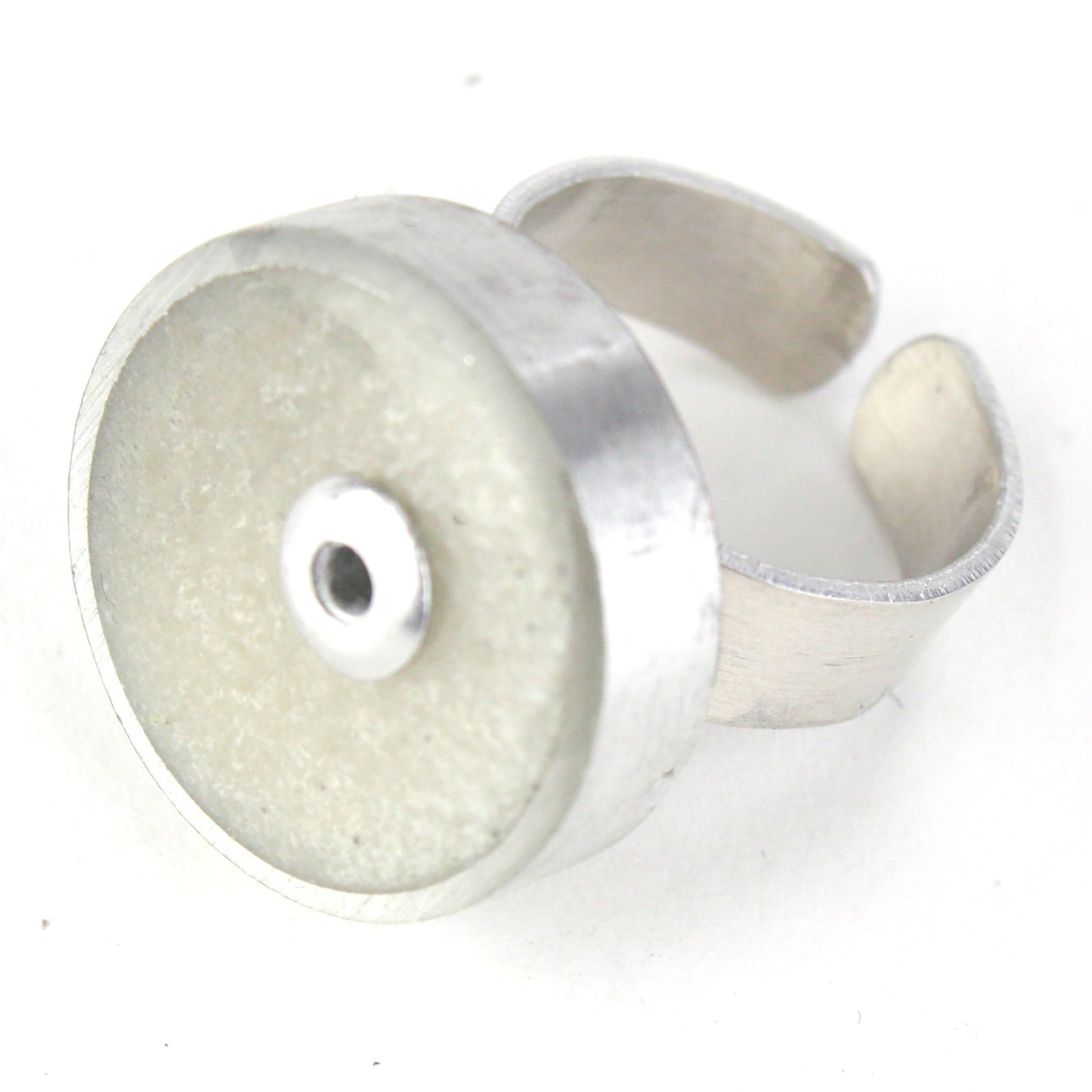White Resinique Single Circle Ring with a pearly eco-resin centerpiece set in salvaged aluminum and an adjustable band.