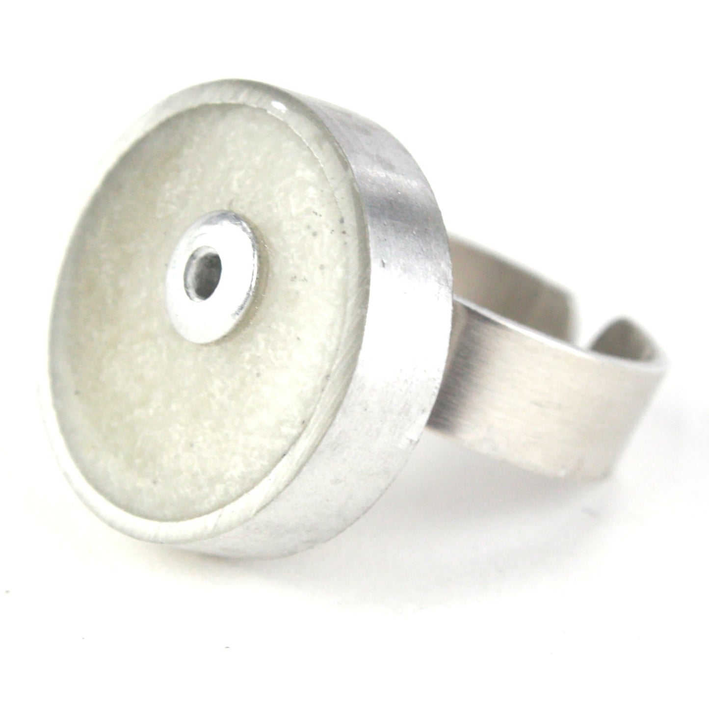 White Resinique Single Circle Ring with a pearly eco-resin centerpiece set in salvaged aluminum and an adjustable band.
