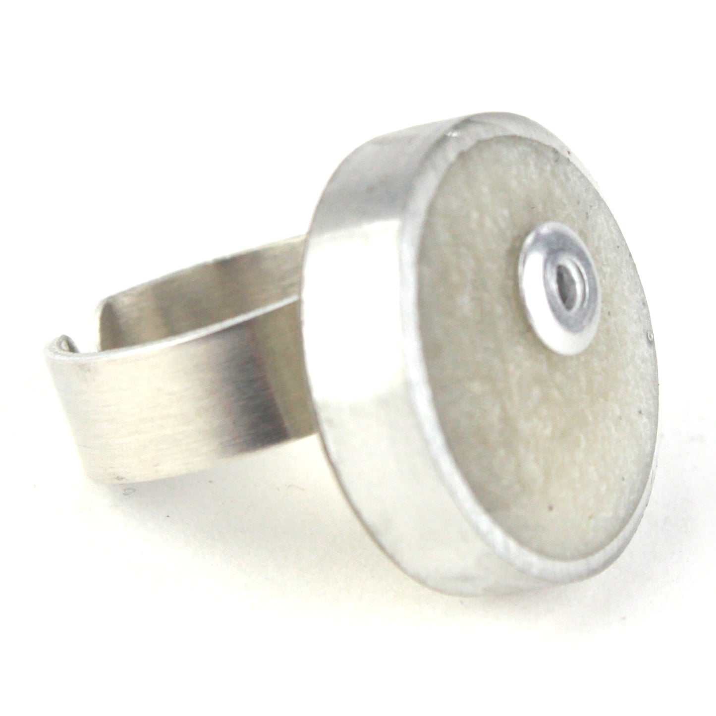 White Resinique Single Circle Ring with a pearly eco-resin centerpiece set in salvaged aluminum and an adjustable band.