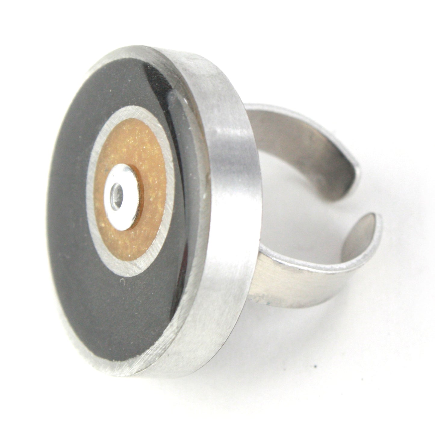 Black and gold Resinique Double Circle Ring made from eco-resin and salvaged aluminum with an adjustable band for a sustainable and bold accessory.
