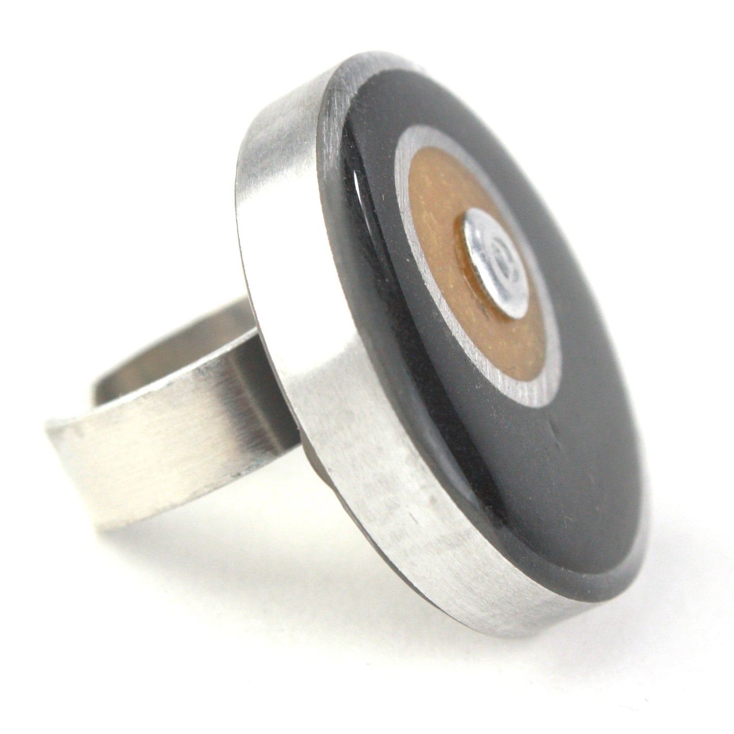 Black and gold Resinique Double Circle Ring made from eco-resin and salvaged aluminum with an adjustable band for a sustainable and bold accessory.