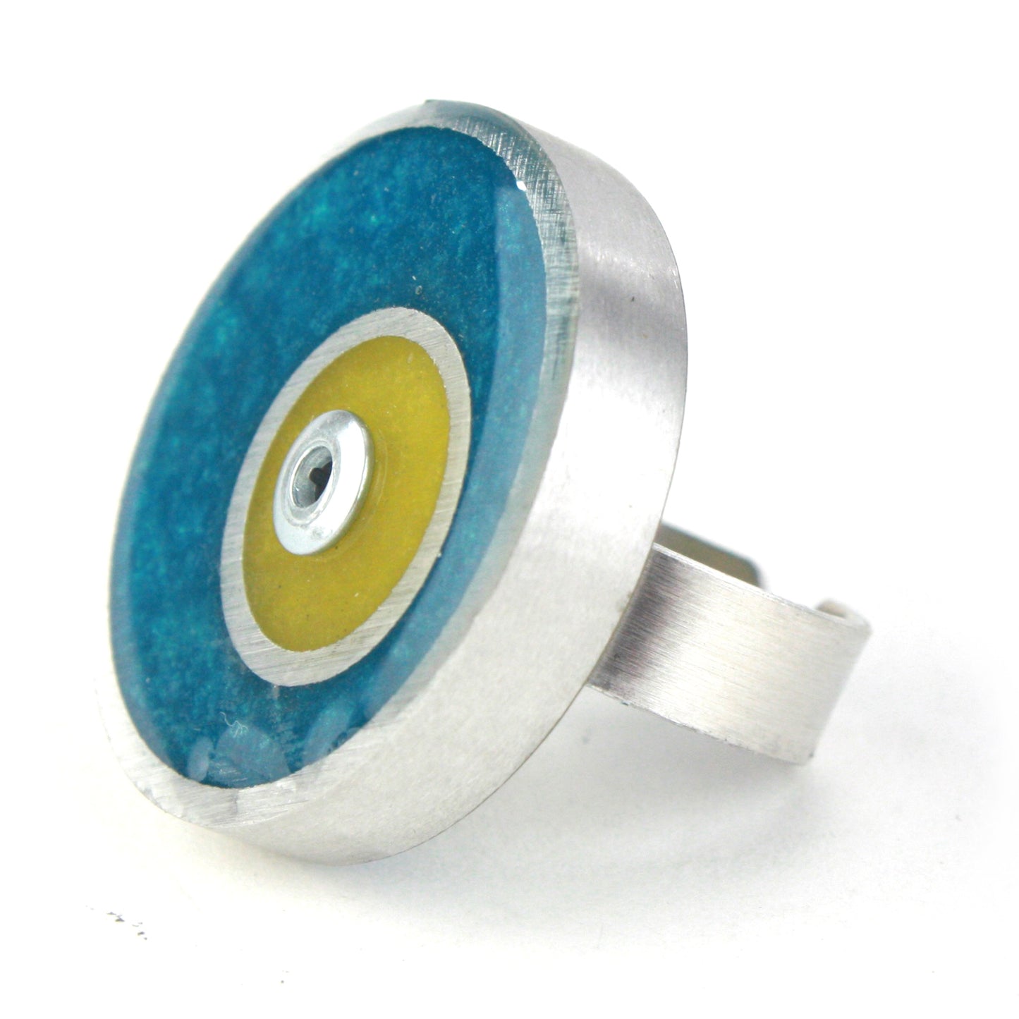 Teal and yellow Resinique Double Circle Ring crafted with eco-resin and salvaged aluminum, featuring a fully adjustable band for stylish comfort.