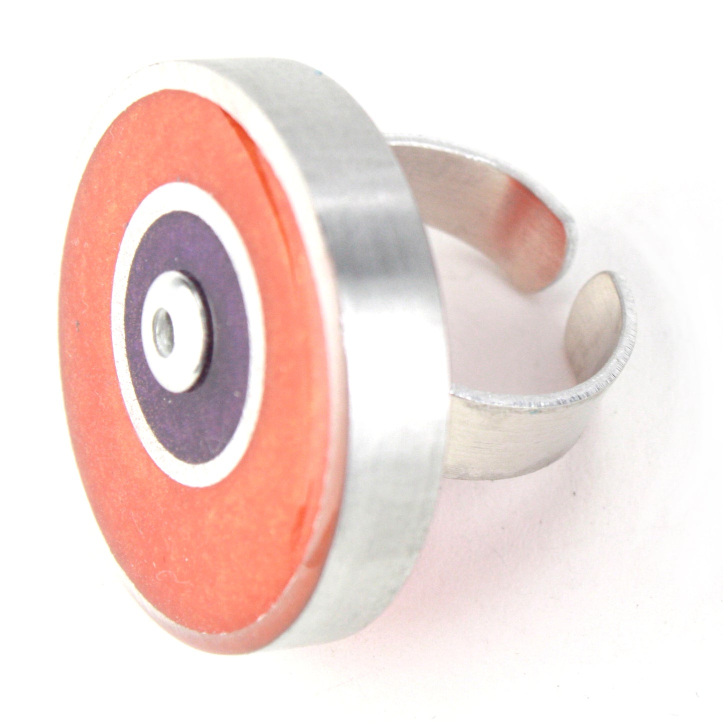 Orange and purple Resinique Double Circle Ring made from eco-resin and salvaged aluminum, featuring an adjustable band for a unique and sustainable accessory.