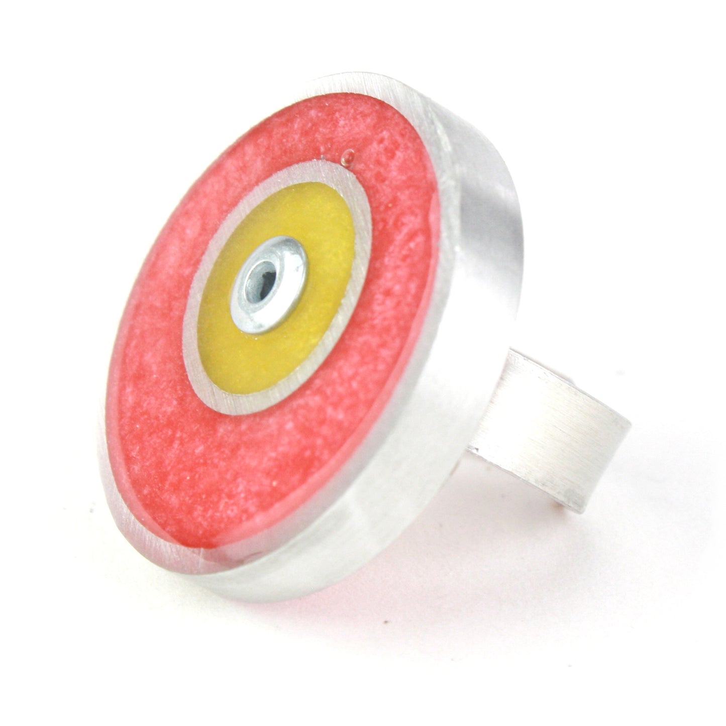 Pink and yellow Resinique Double Circle Ring with eco-resin and salvaged aluminum, featuring a fully adjustable band for playful, sustainable style.