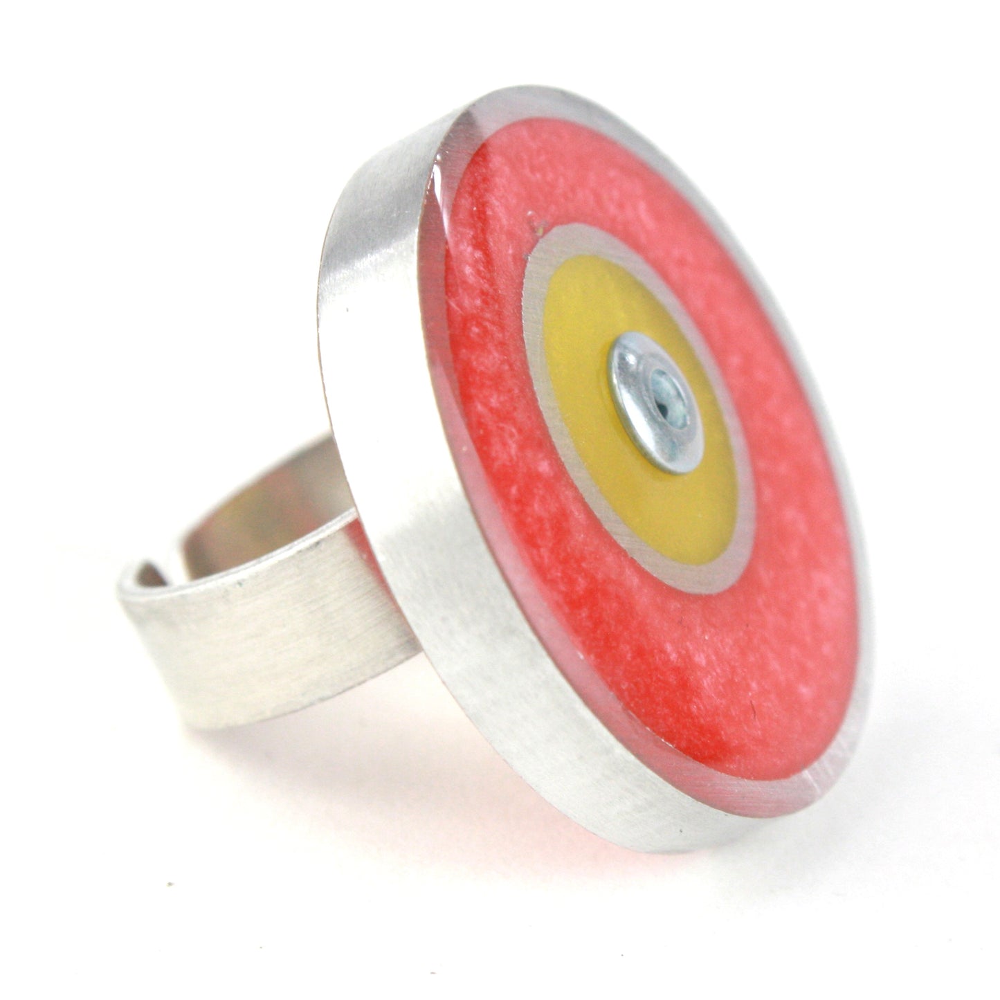 Pink and yellow Resinique Double Circle Ring with eco-resin and salvaged aluminum, featuring a fully adjustable band for playful, sustainable style.
