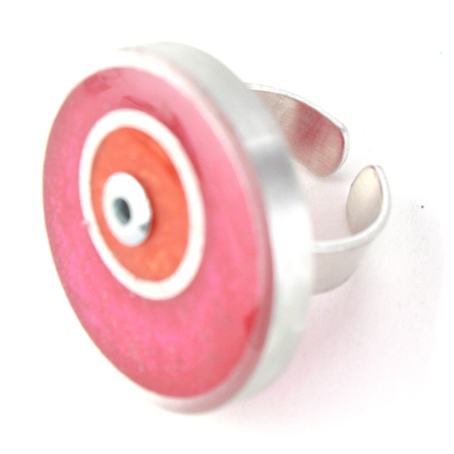 Bright pink and orange double circle ring made from salvaged aluminum and eco-resin with an adjustable band.