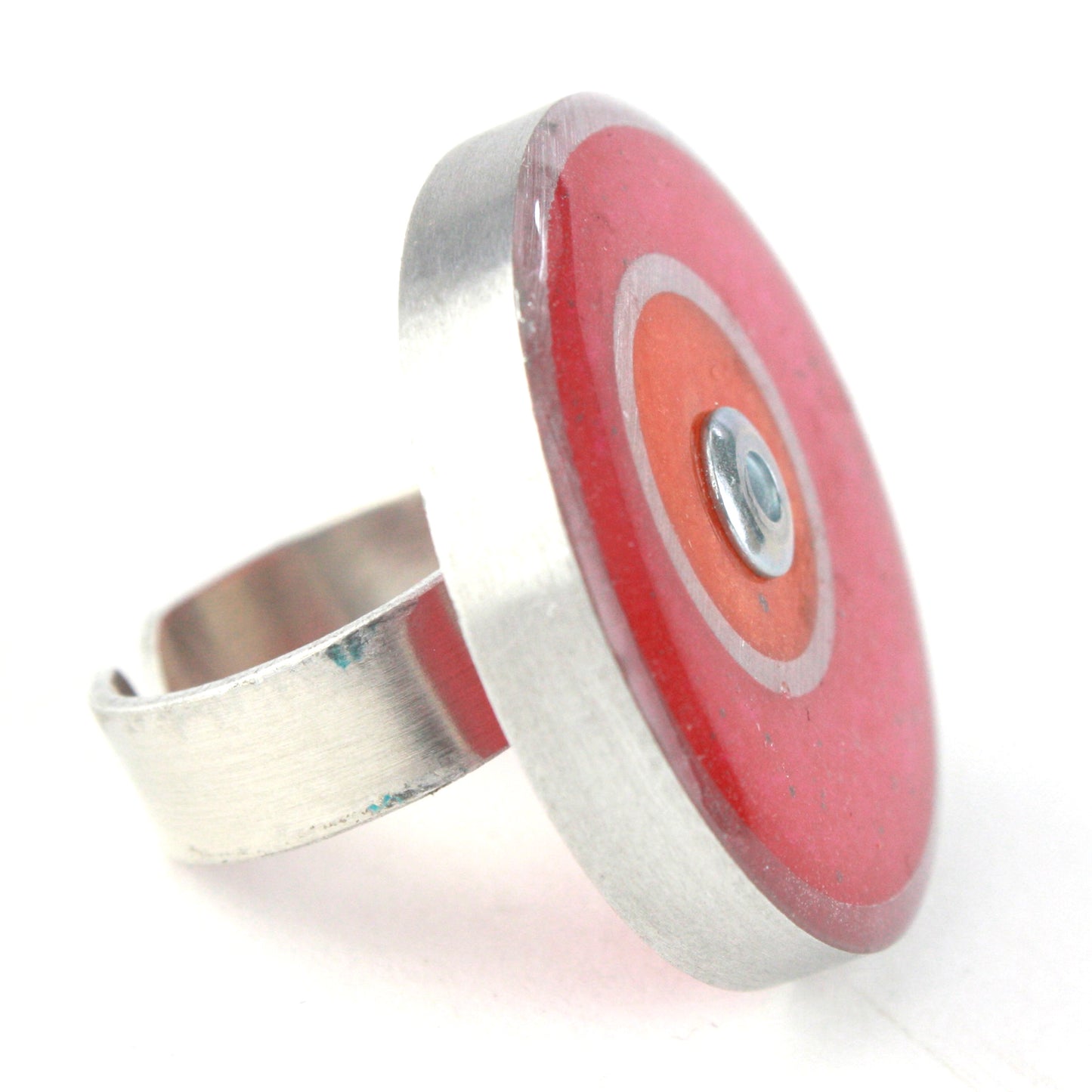 Bright pink and orange double circle ring made from salvaged aluminum and eco-resin with an adjustable band.