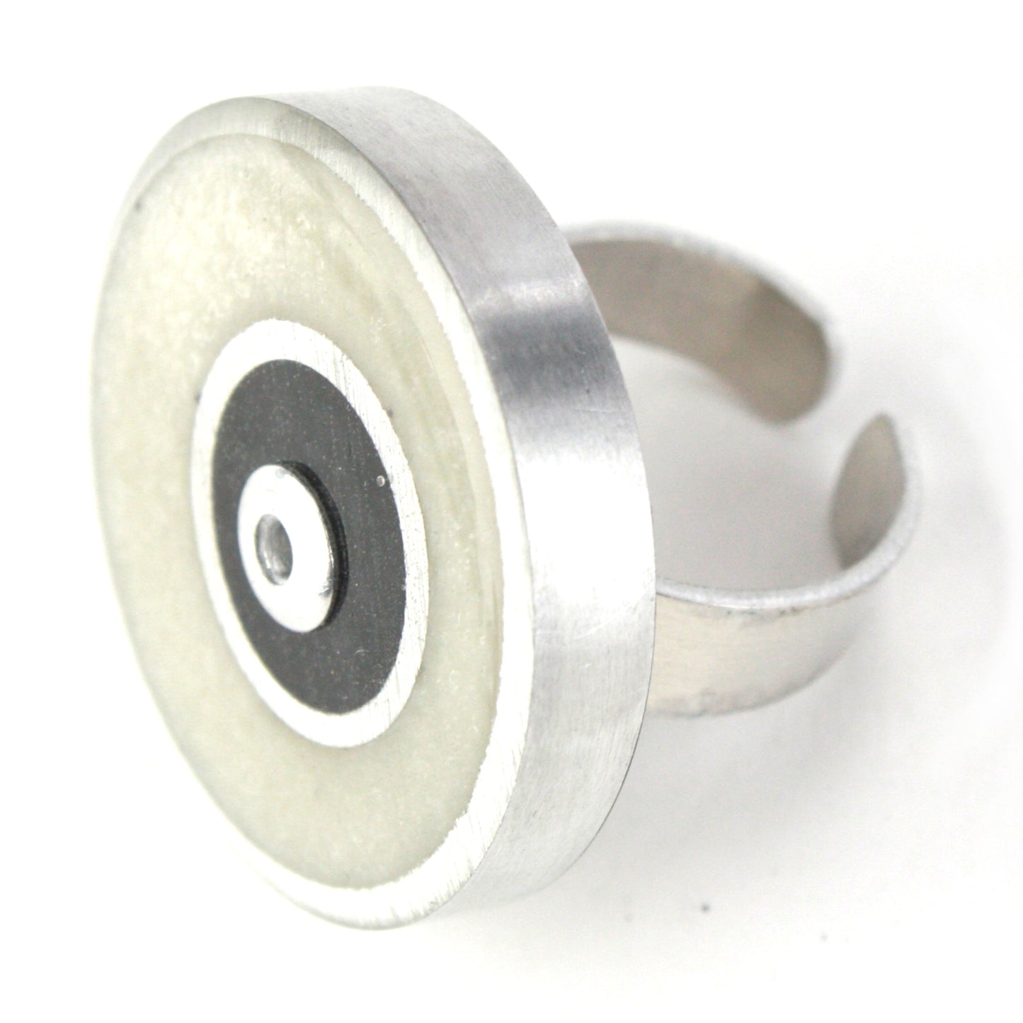 White and black Resinique Double Circle Ring crafted from eco-resin and salvaged aluminum, featuring an adjustable band for minimalist sustainable style.
