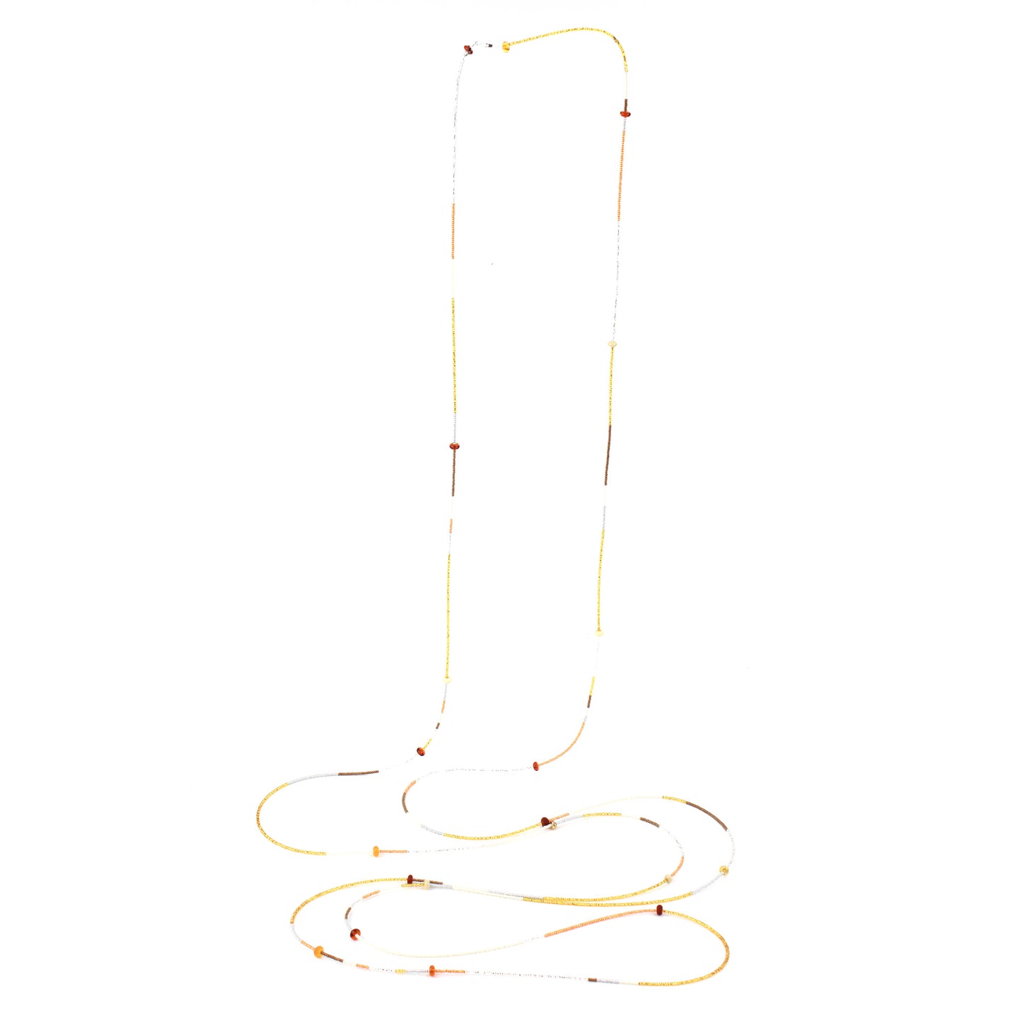 A 12-foot necklace crafted with tiny glass seed beads in warm golden, amber, and earthy tones, accented by handcrafted lampworked beads. Featuring a secure barrel screw clasp, this versatile piece can be styled as a layered necklace or wrapped around the wrist as a bracelet.