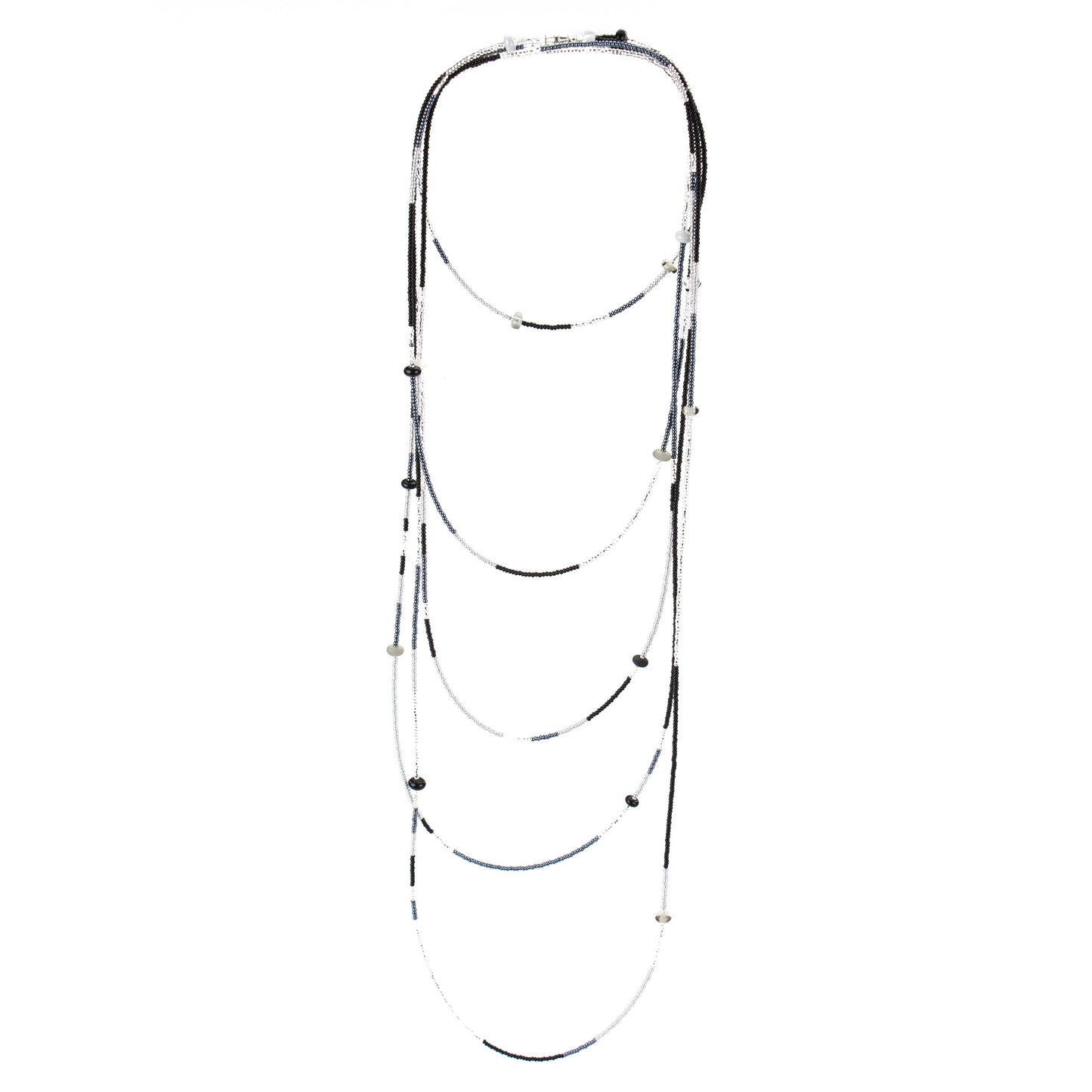 A long, multi-strand necklace featuring a mix of black, white, and silver glass seed beads, accented with handcrafted lampworked glass beads. The necklace is secured with a barrel screw clasp and offers a versatile, elegant design perfect for layering or wearing long.