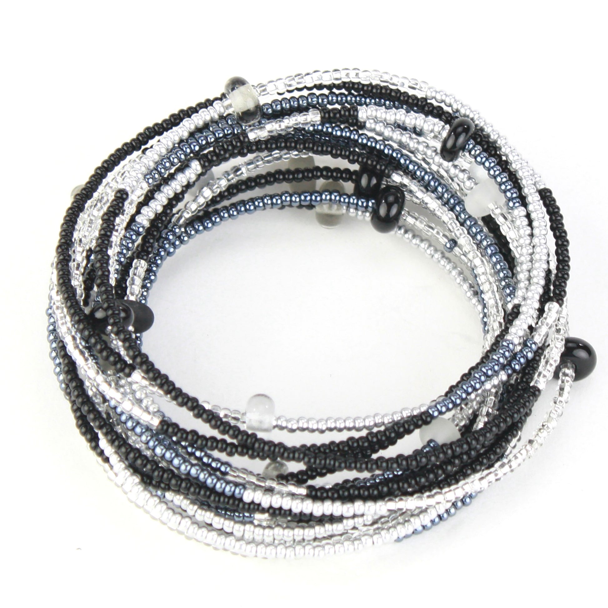 A 12-foot necklace made of black, white, and silver glass seed beads with handcrafted accents, styled here as a wrap bracelet. Its versatile design allows it to be worn as a long necklace, layered, or wrapped around the wrist for a bold bracelet look.