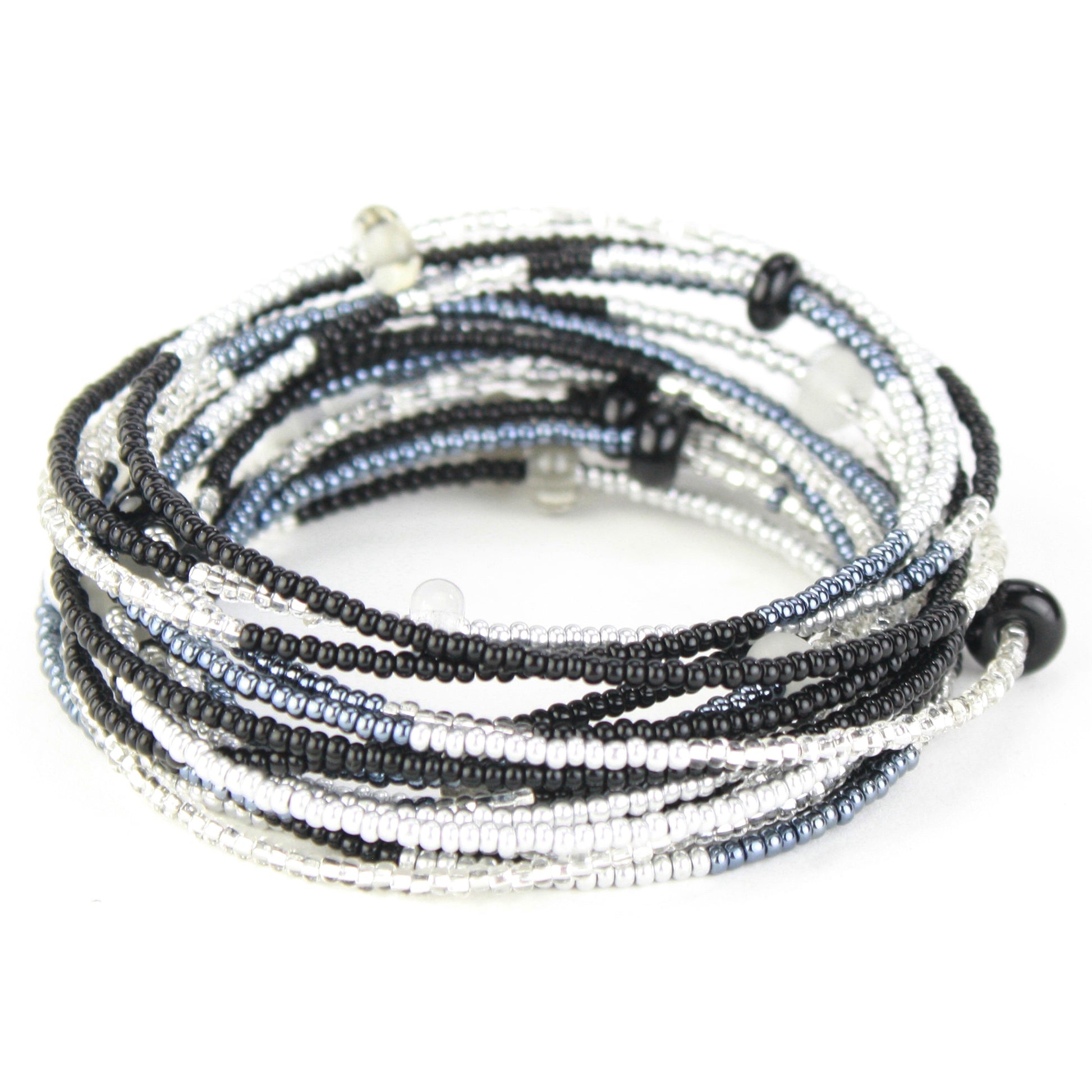 A 12-foot necklace made of black, white, and silver glass seed beads with handcrafted accents, styled here as a wrap bracelet. Its versatile design allows it to be worn as a long necklace, layered, or wrapped around the wrist for a bold bracelet look.
