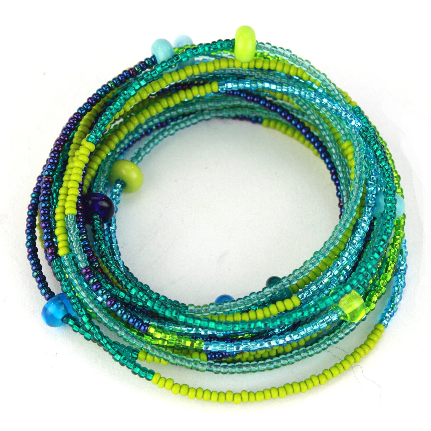 A vibrant 12-foot necklace featuring glass seed beads in shades of green, blue, and yellow, accented with handcrafted lampworked beads. Shown here wrapped as a bracelet, its versatile design allows it to be worn long, layered, or styled as a bold multi-strand bracelet.