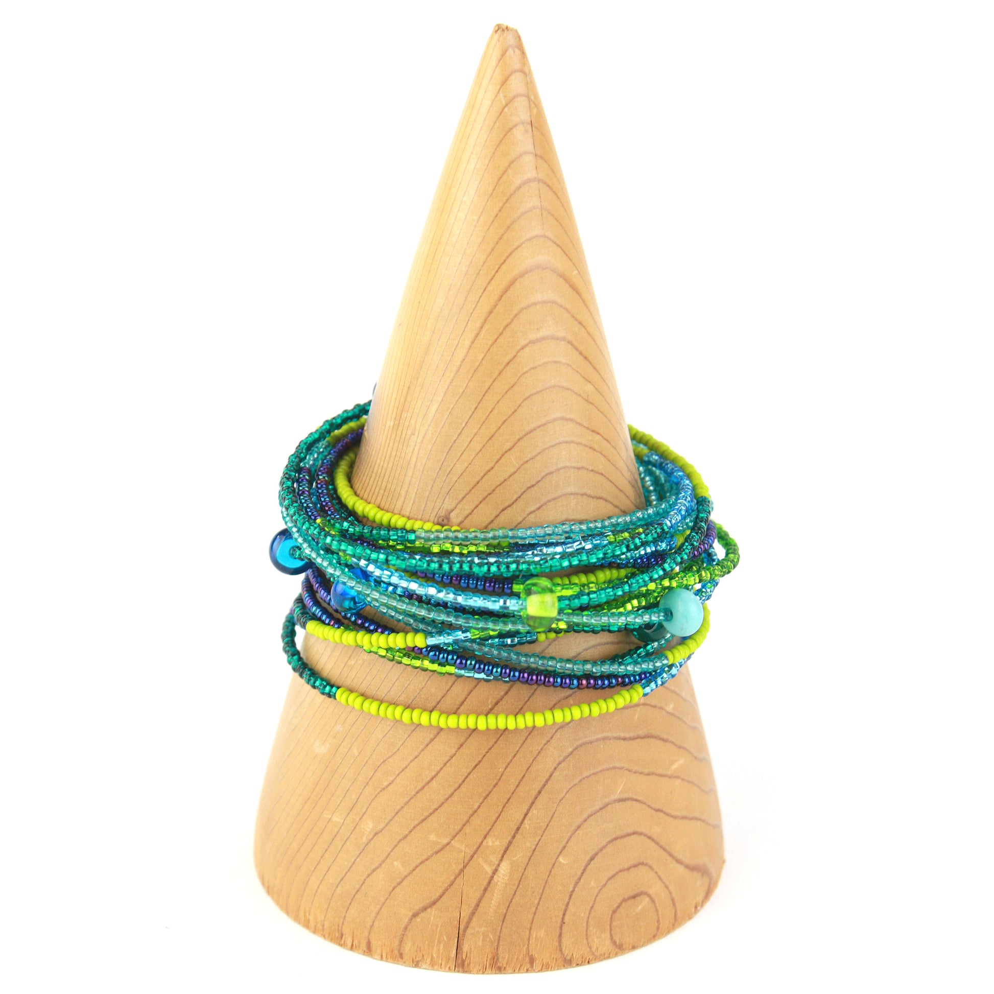 A vibrant 12-foot necklace featuring glass seed beads in shades of green, blue, and yellow, accented with handcrafted lampworked beads. Shown here wrapped as a bracelet, its versatile design allows it to be worn long, layered, or styled as a bold multi-strand bracelet.