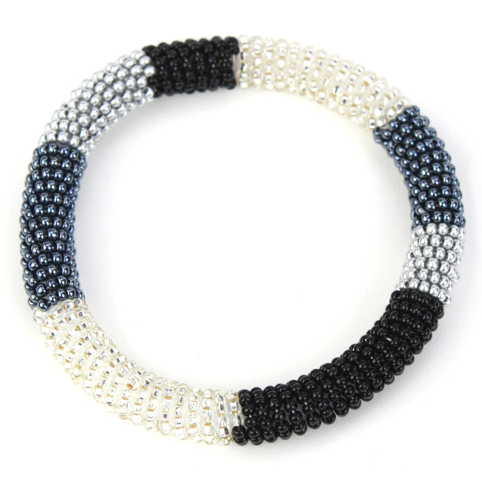 A sleek bangle bracelet made with tiny glass beads in black, silver, and white tones, wrapped around a flexible silicone core for easy slip-on wear.