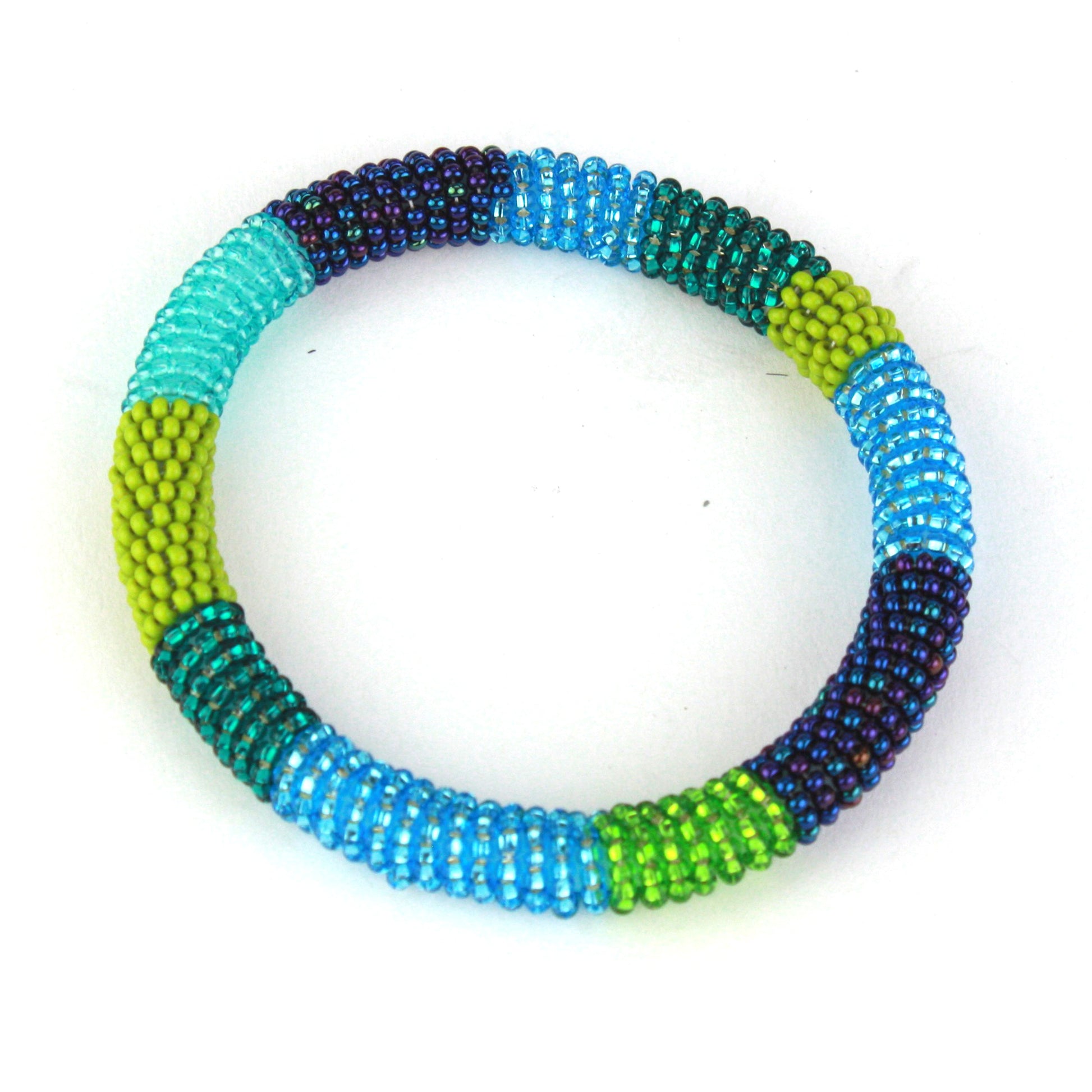 A vibrant bangle bracelet featuring tiny glass beads in shades of blue, teal, green, and purple, wrapped around a flexible silicone core for easy slip-on wear.
