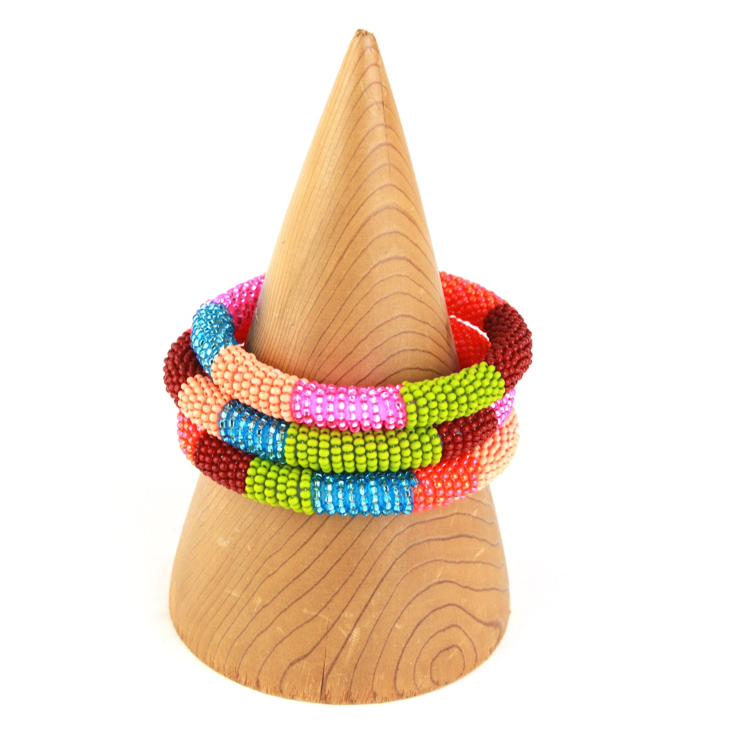 A colorful bangle bracelet featuring tiny glass beads in bold shades of pink, blue, orange, green, and red, wrapped around a flexible silicone core for easy wear.