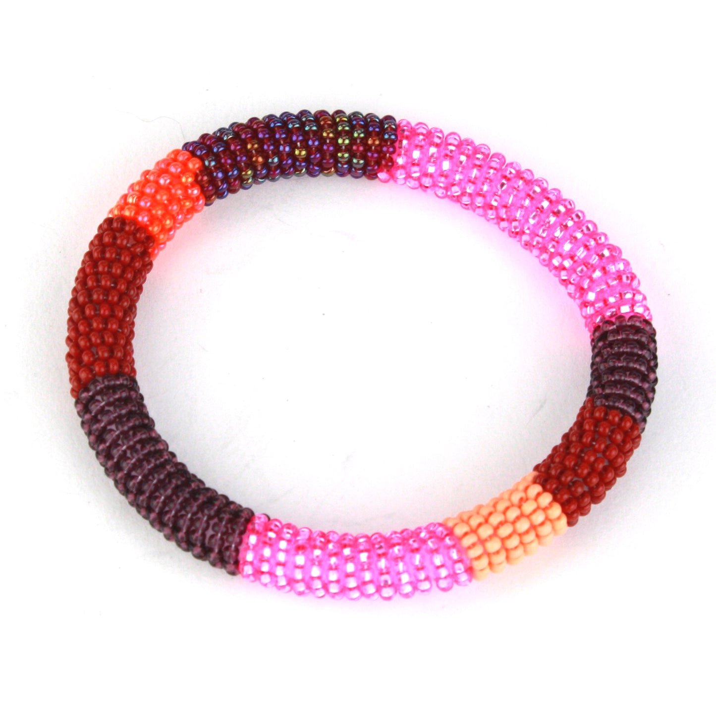 A bold bangle bracelet featuring tiny glass beads in shades of pink, red, maroon, and orange, wrapped around a flexible silicone core for effortless wear.