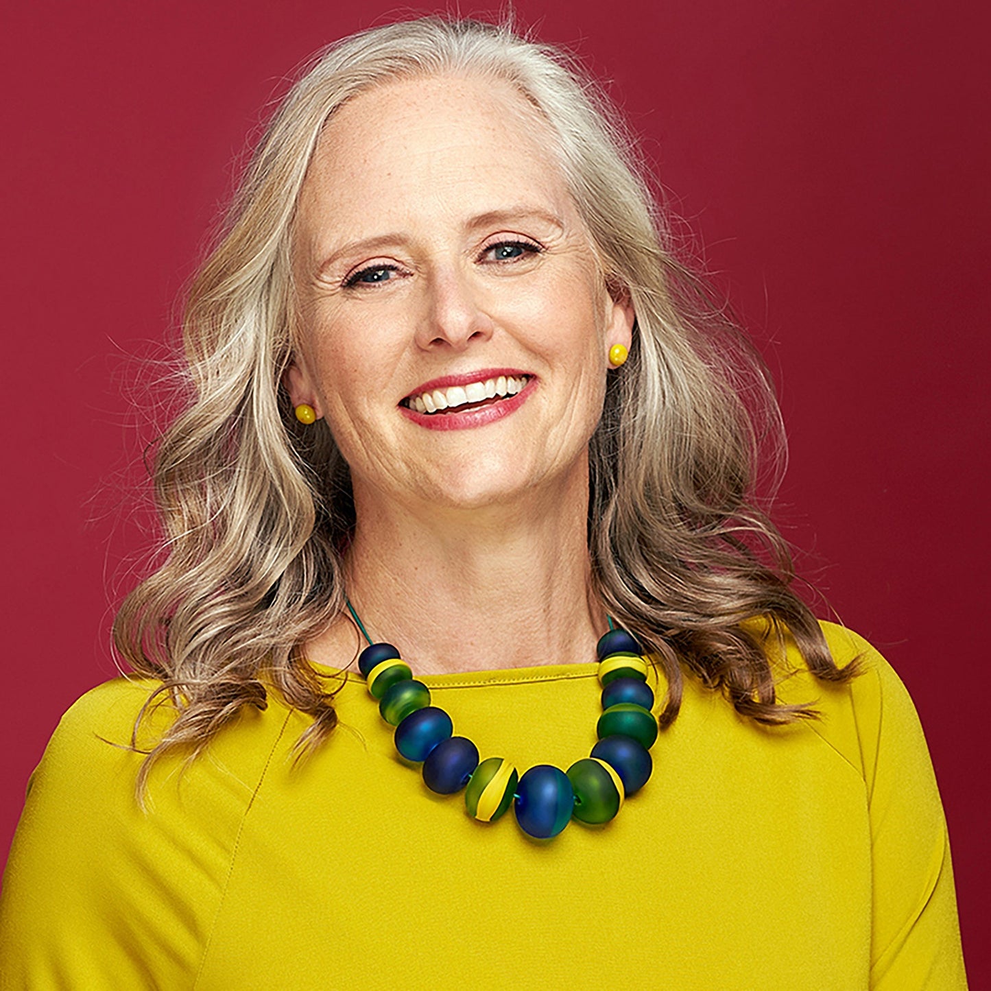 Soft Stripes Necklace with hand-blown, sandblasted turquoise glass beads accented by green and yellow, strung on an adjustable fine leather cord.