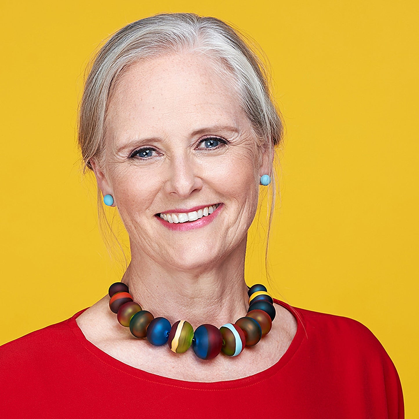 Soft Stripes Necklace with hand-blown sandblasted glass beads in multicolored hues, strung on an adjustable fine leather cord.
