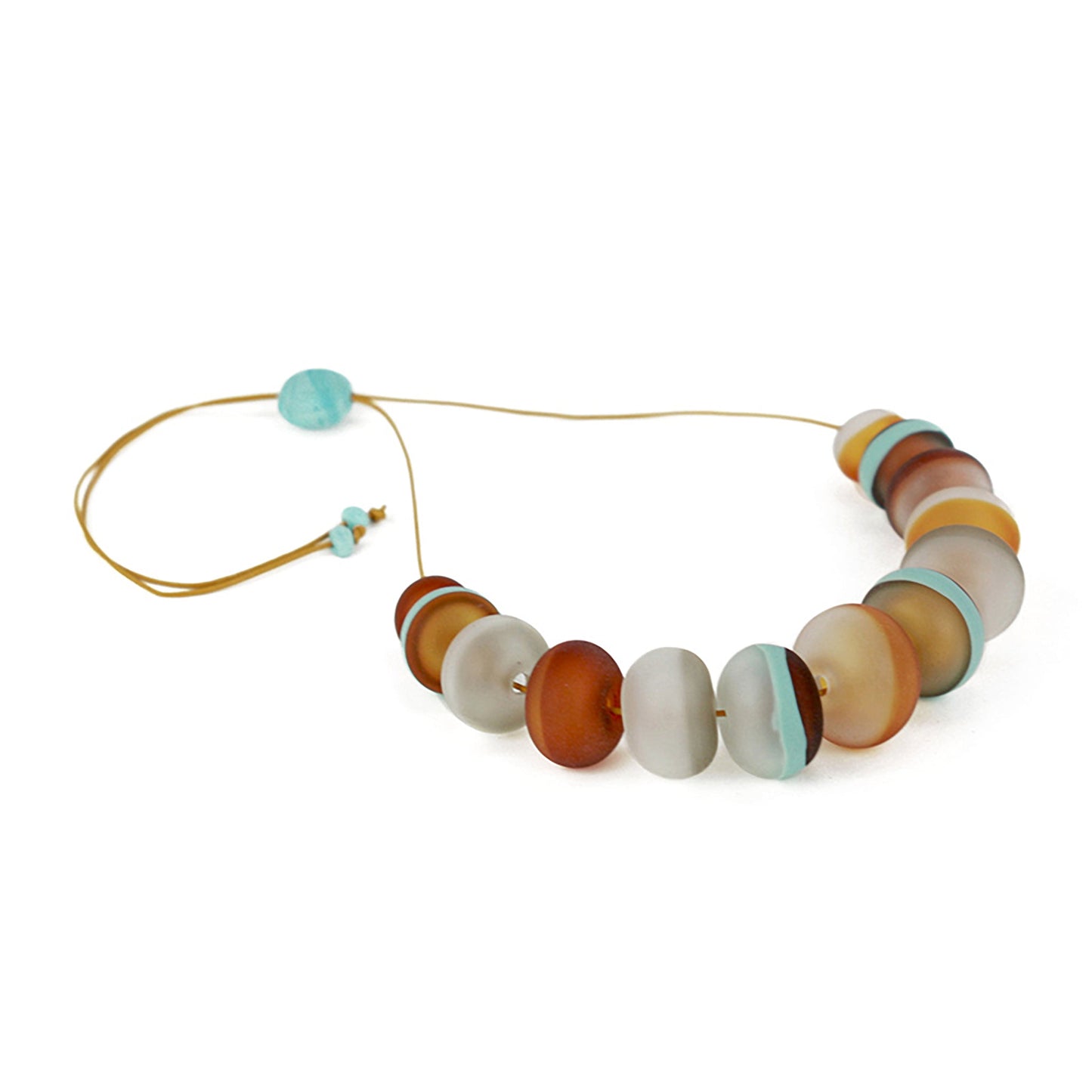Soft Stripes Necklace with hand-blown sandblasted glass beads in white, grey, amber, and blue hues, strung on an adjustable fine leather cord.