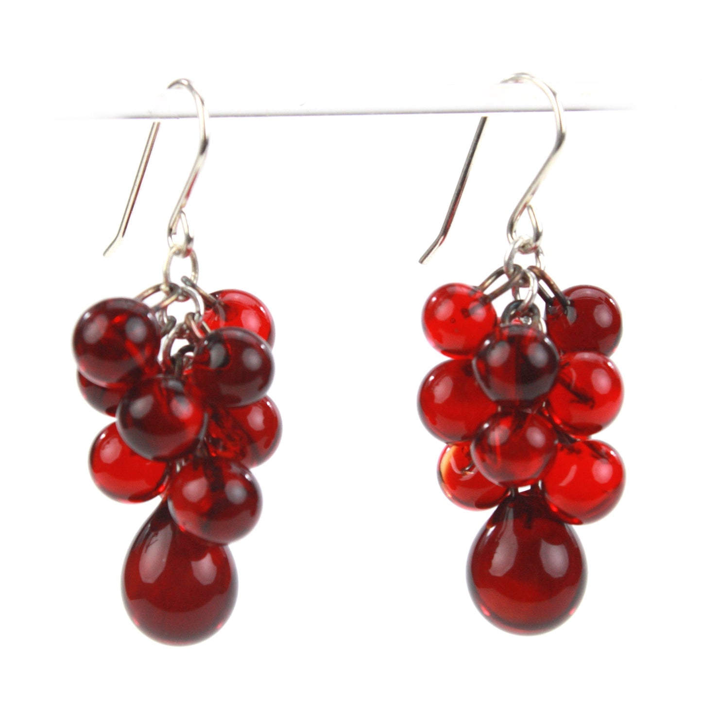 Ruby Red Glass Cluster Earrings with cascading glass beads and teardrop accents, paired with sterling silver ear wires for a vibrant, elegant statement.