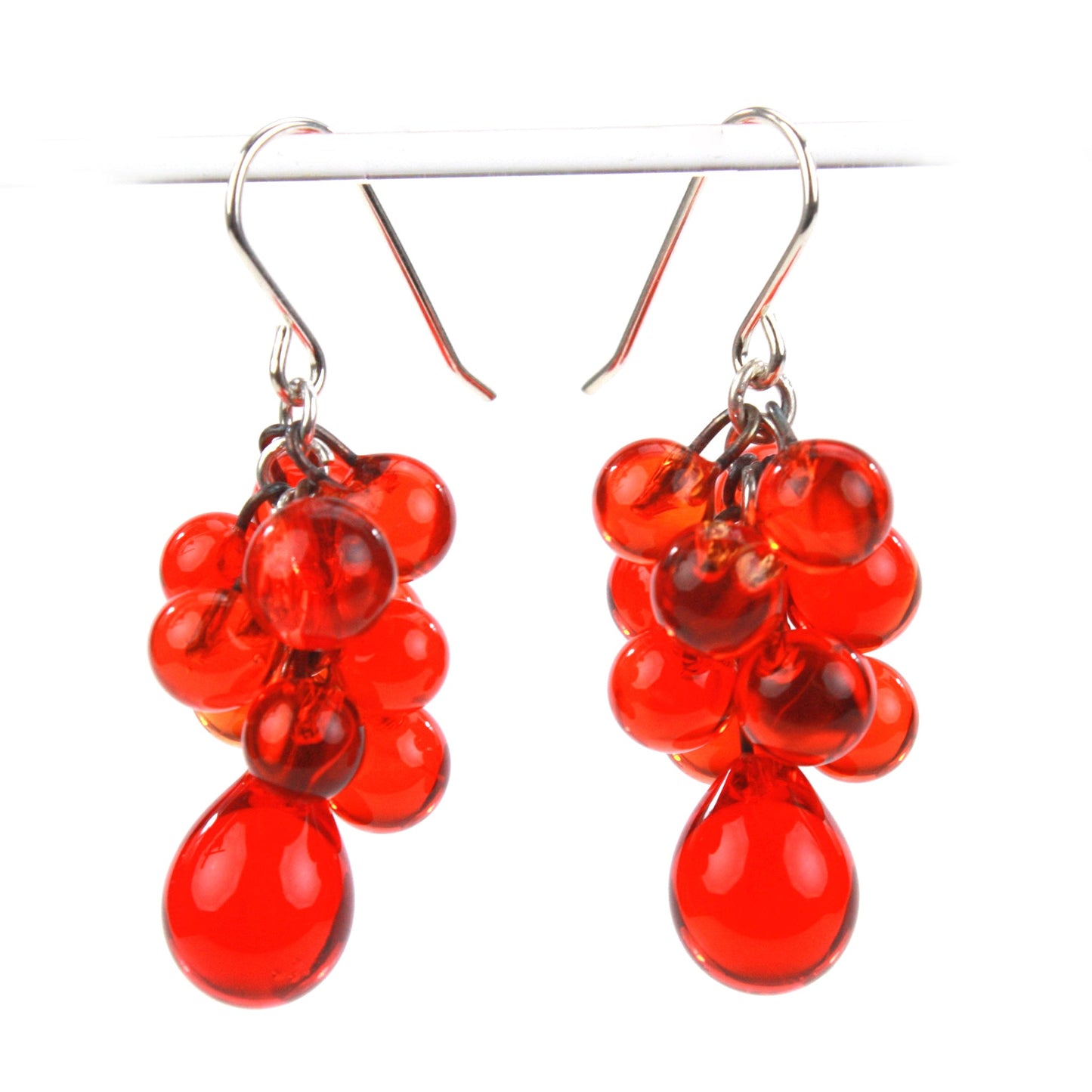 Cherry Red Glass Cluster Earrings featuring handblown beads in a cascading design with teardrop accents and sterling silver ear wires.
