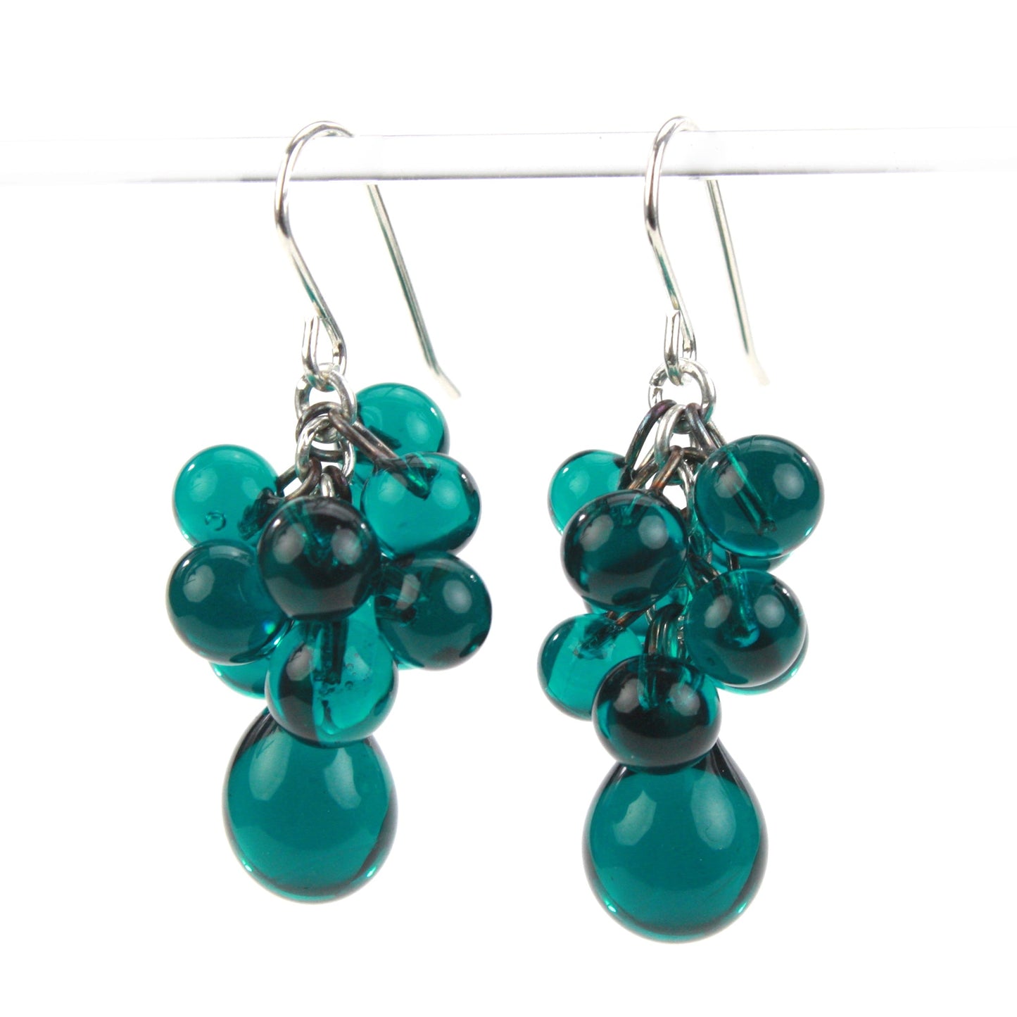 Teal Glass Cluster Earrings featuring handblown beads in a cascading design with teardrop accents and sterling silver ear wires.