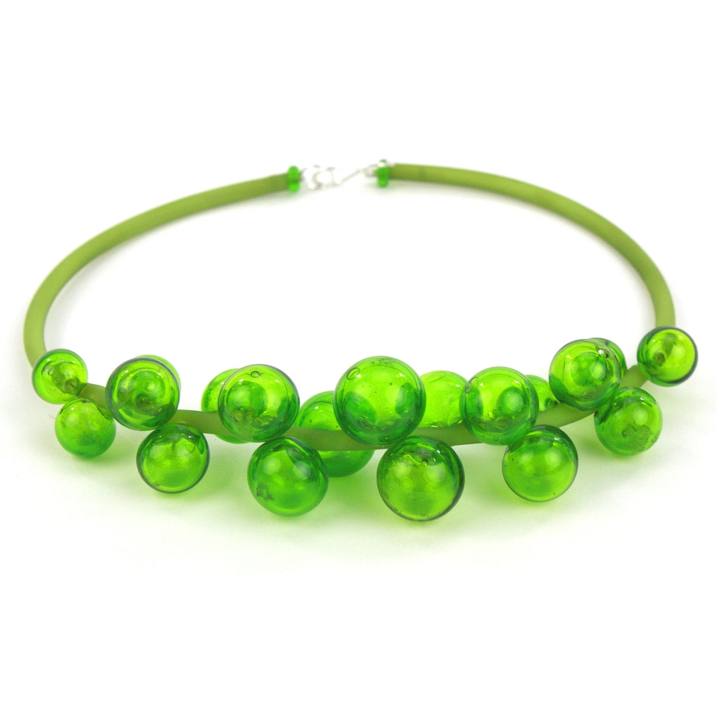 A vibrant green Chroma necklace featuring clustered handblown glass beads strung on steel wire and threaded through a green hand-dyed silicone cord with a sterling silver clasp.