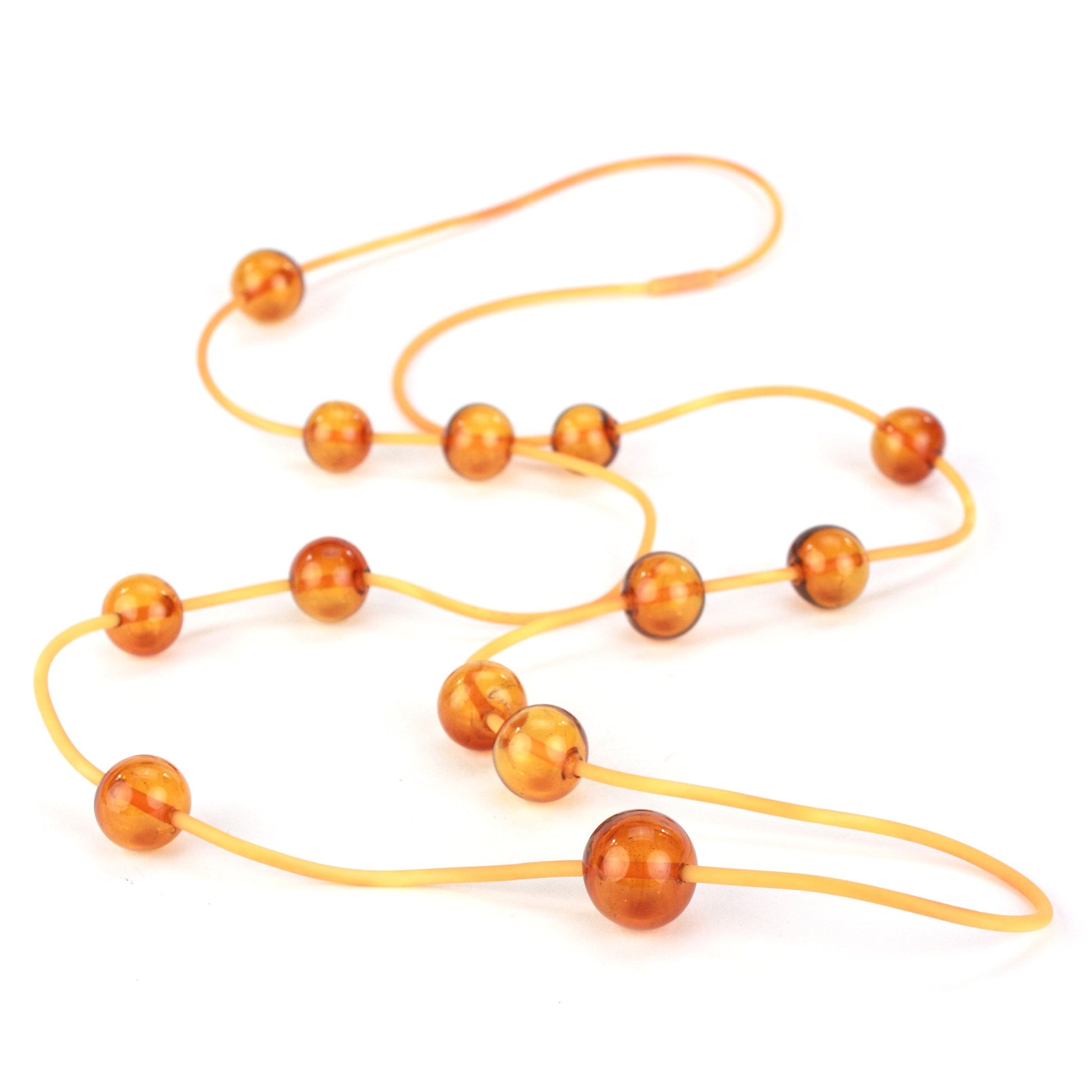 Amber Orbit Necklace with handblown glass beads on a hand-dyed silicone cord, featuring adjustable bead positions and multiple styling options.