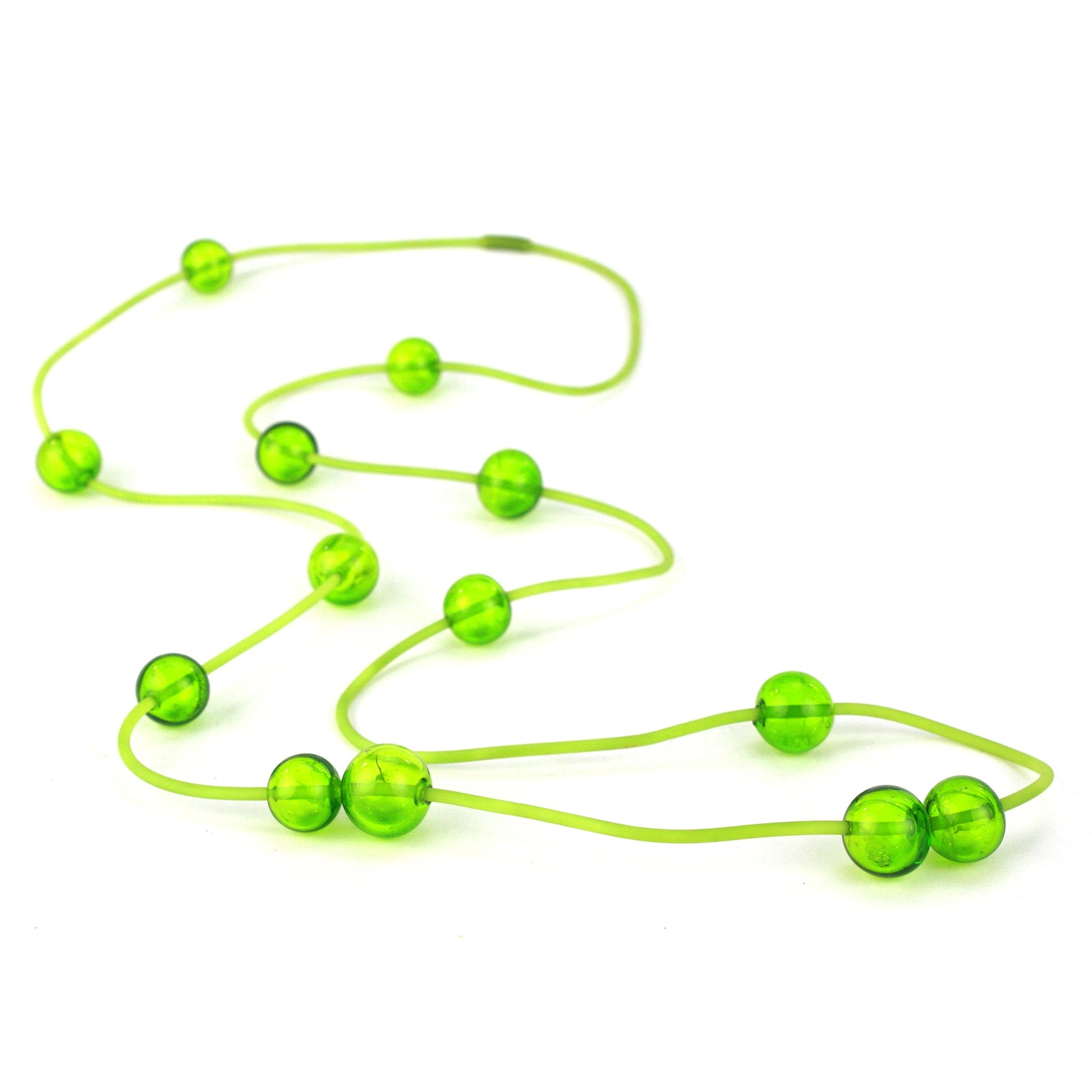 Orbit Necklace in Lime with handblown glass beads on a hand-dyed silicone cord. Features adjustable beads for customizable styling options.